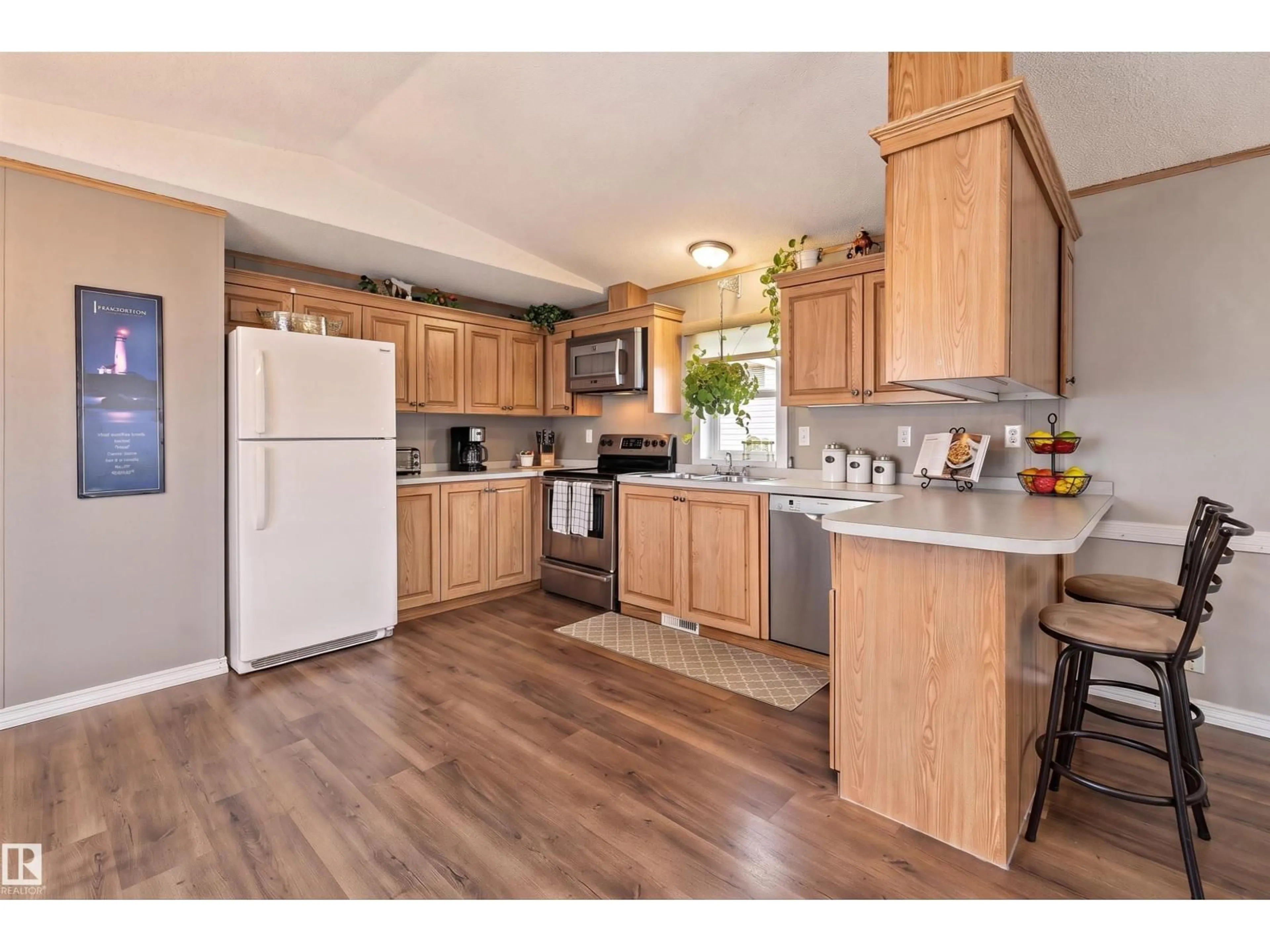 Open concept kitchen, wood/laminate floor for 161 - 3400 48 ST, Stony Plain Alberta T7Z1R9
