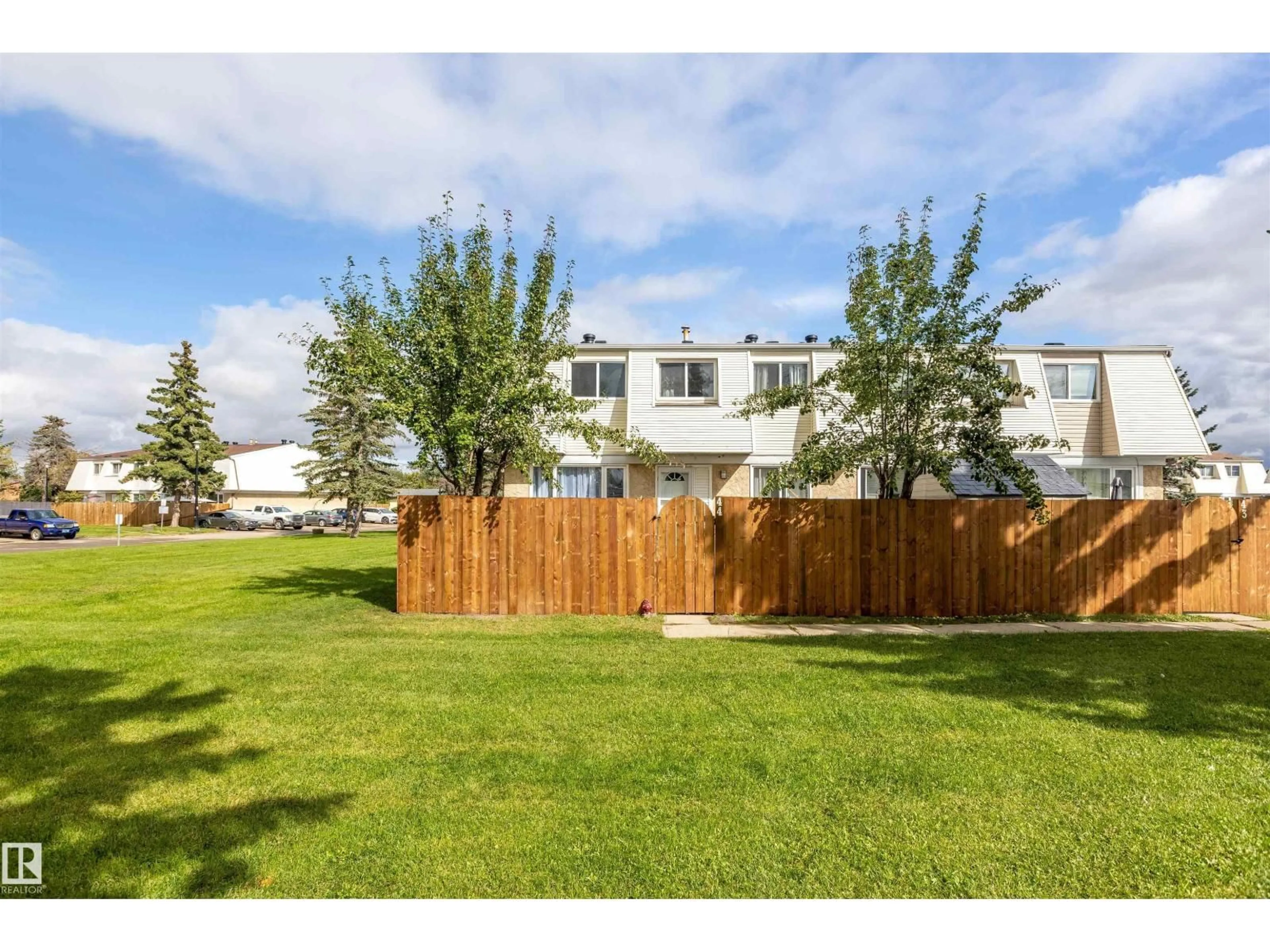 A pic from outside/outdoor area/front of a property/back of a property/a pic from drone, unknown for #44 - 650 GRANDIN DR, Morinville Alberta T8R1K5