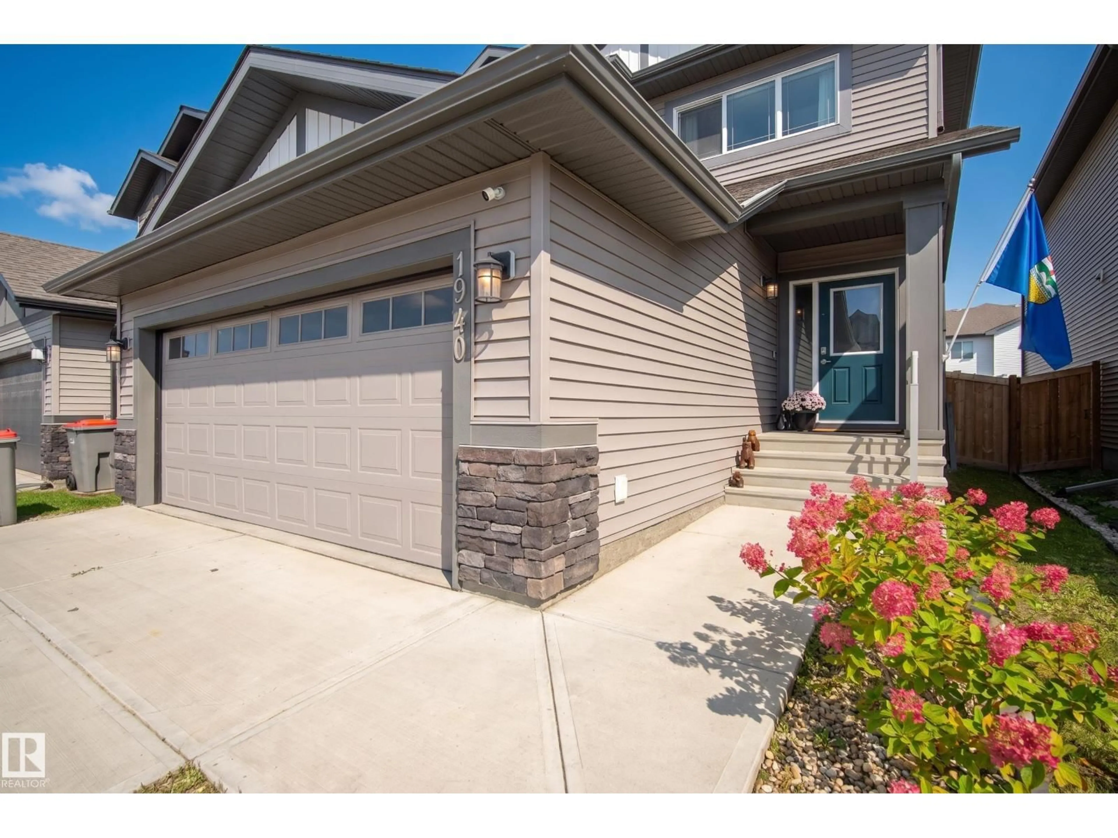 Home with vinyl exterior material, street for 1940 WESTERRA LN, Stony Plain Alberta T7Z0M9