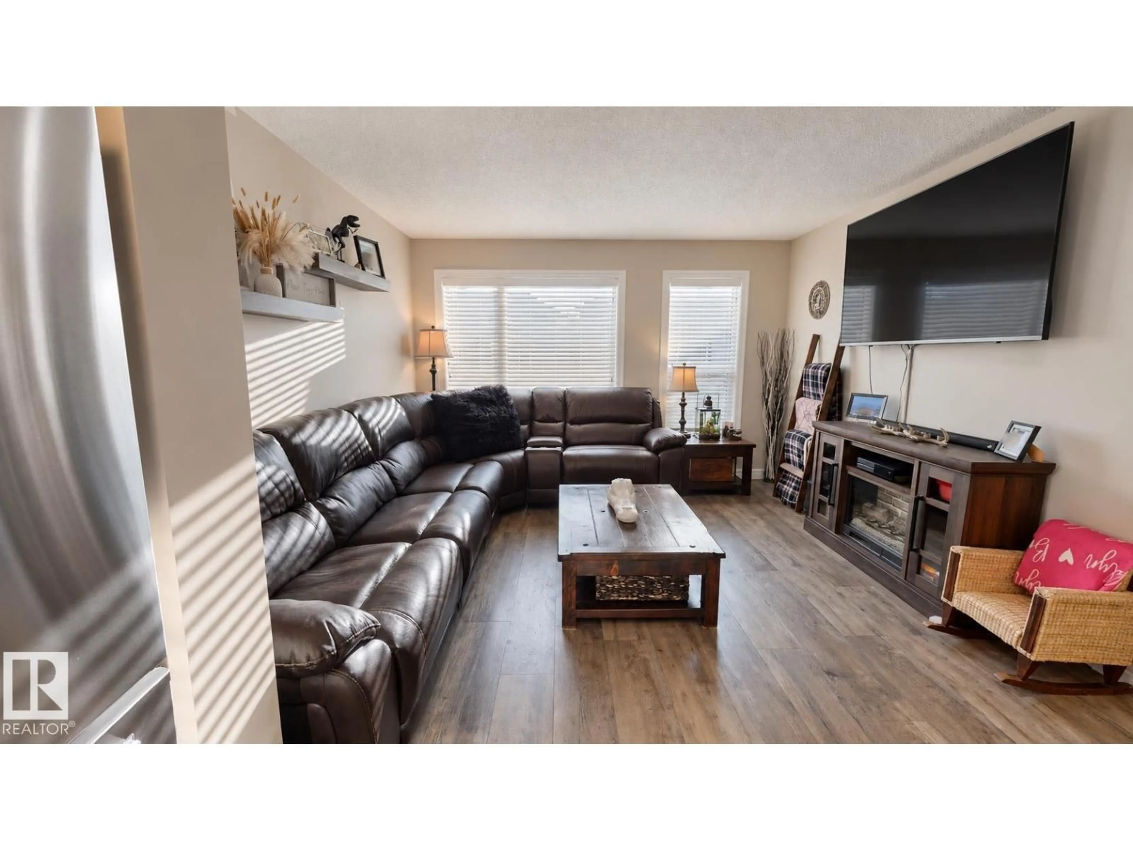 Living room with furniture, wood/laminate floor for 56 TRIBUTE CM, Spruce Grove Alberta T7X0W6