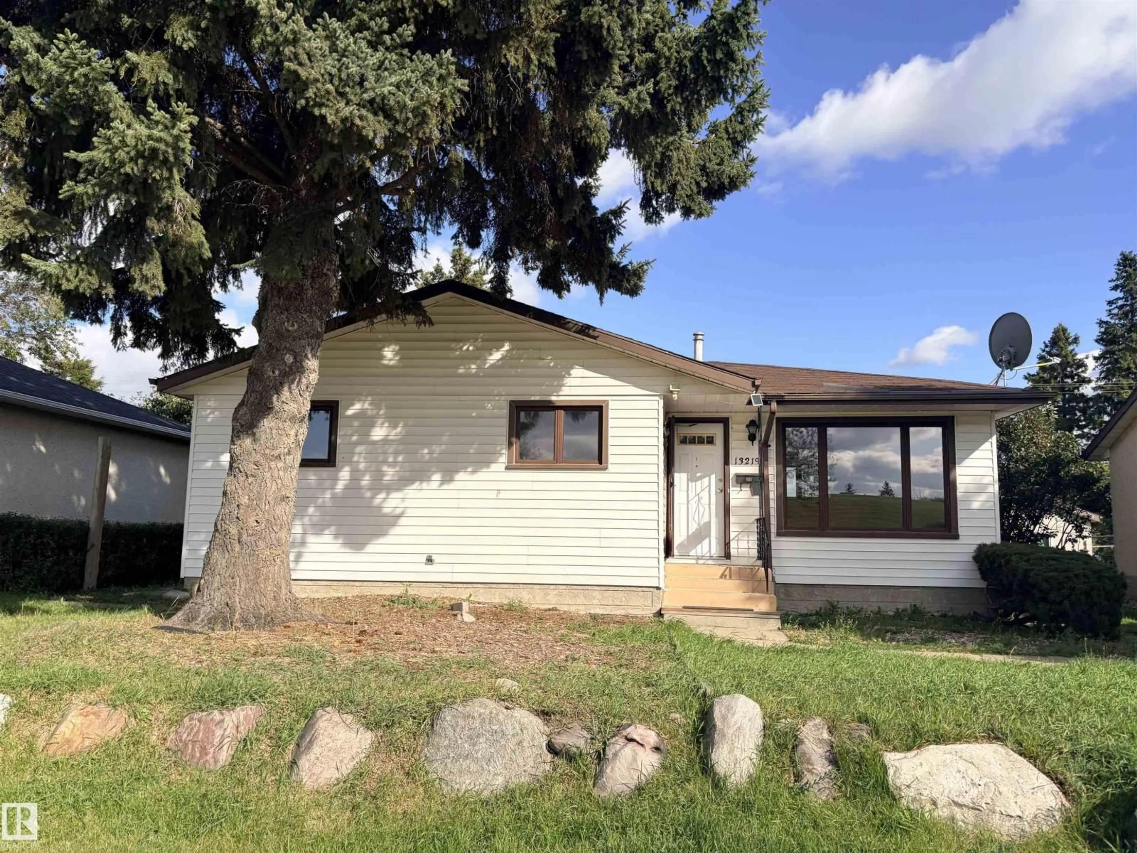 Home with vinyl exterior material, street for 13219 107 ST, Edmonton Alberta T5E4W1