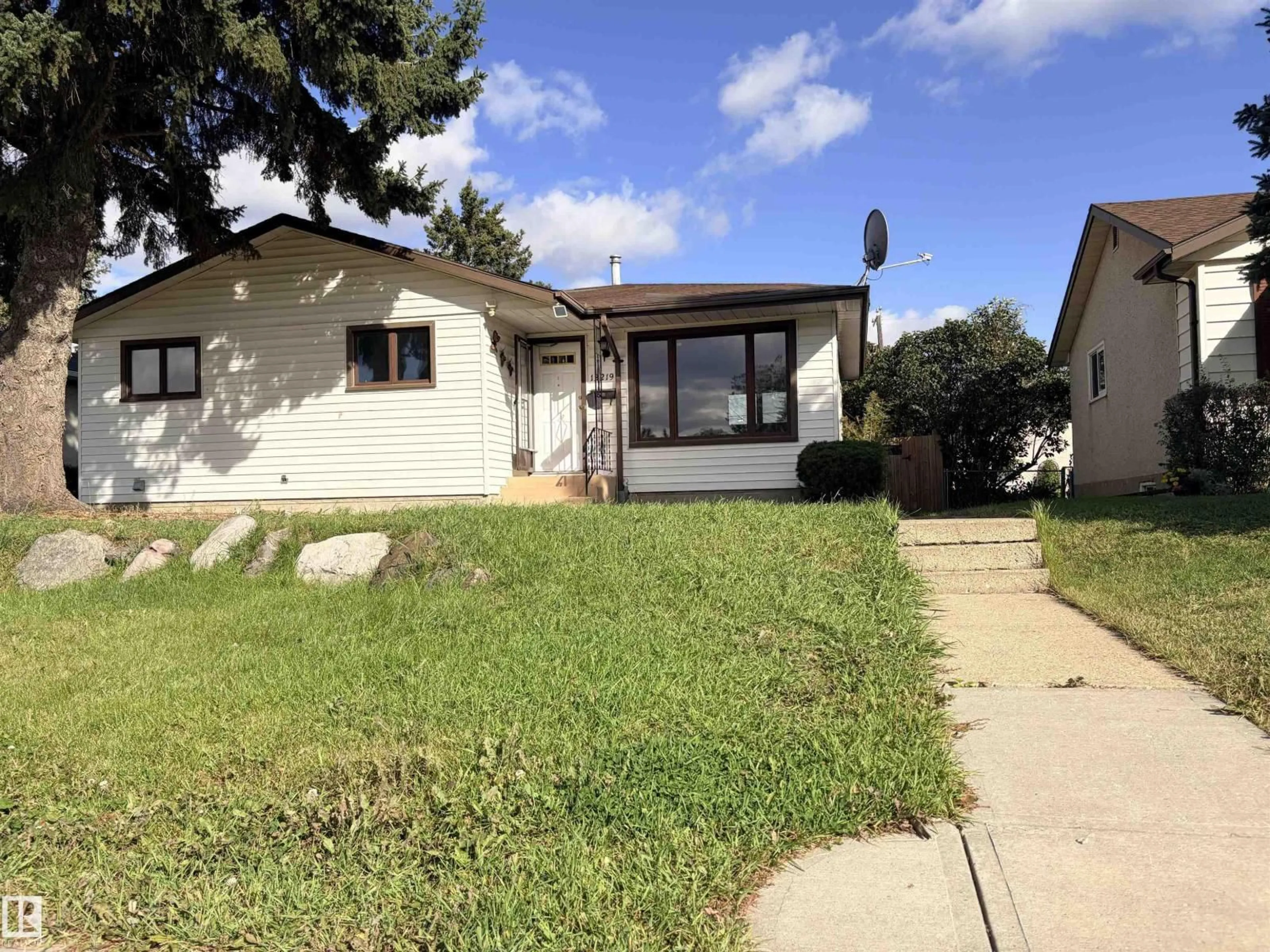 Home with vinyl exterior material, street for 13219 107 ST, Edmonton Alberta T5E4W1