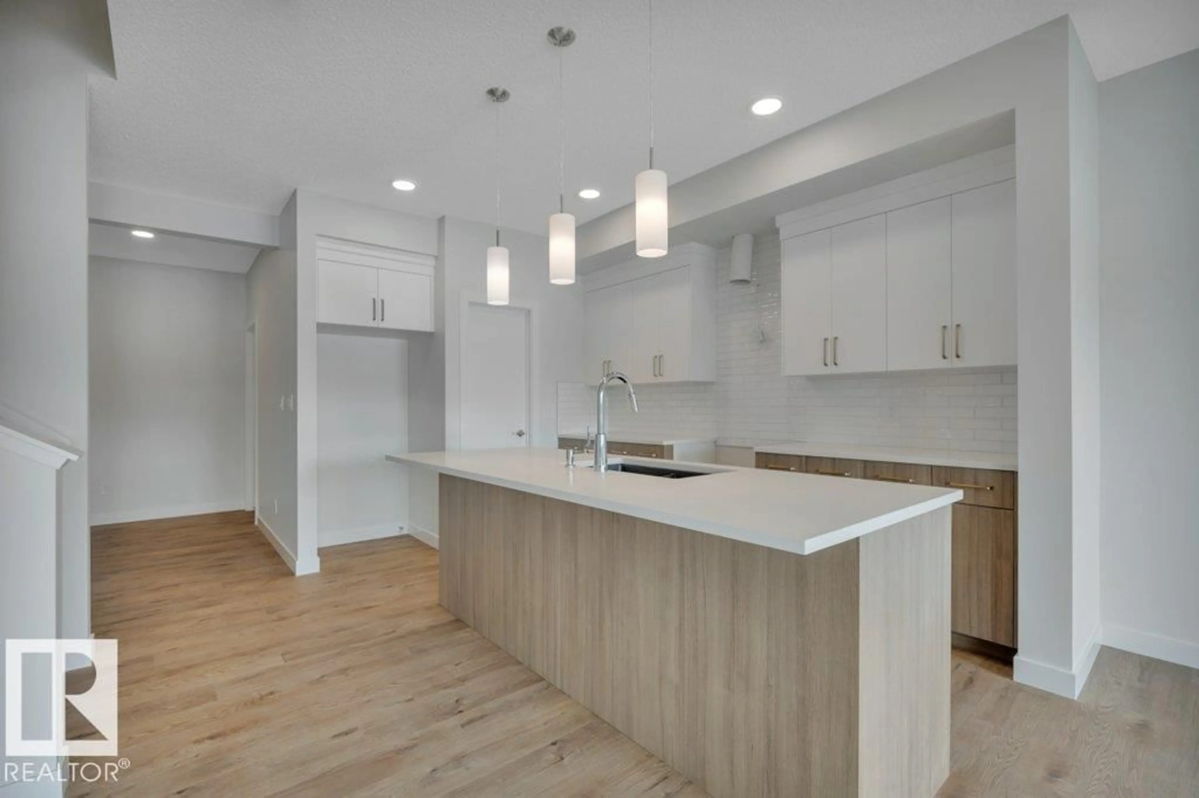 Open concept kitchen, wood/laminate floor for 18643 19 AV, Edmonton Alberta T6M3M9