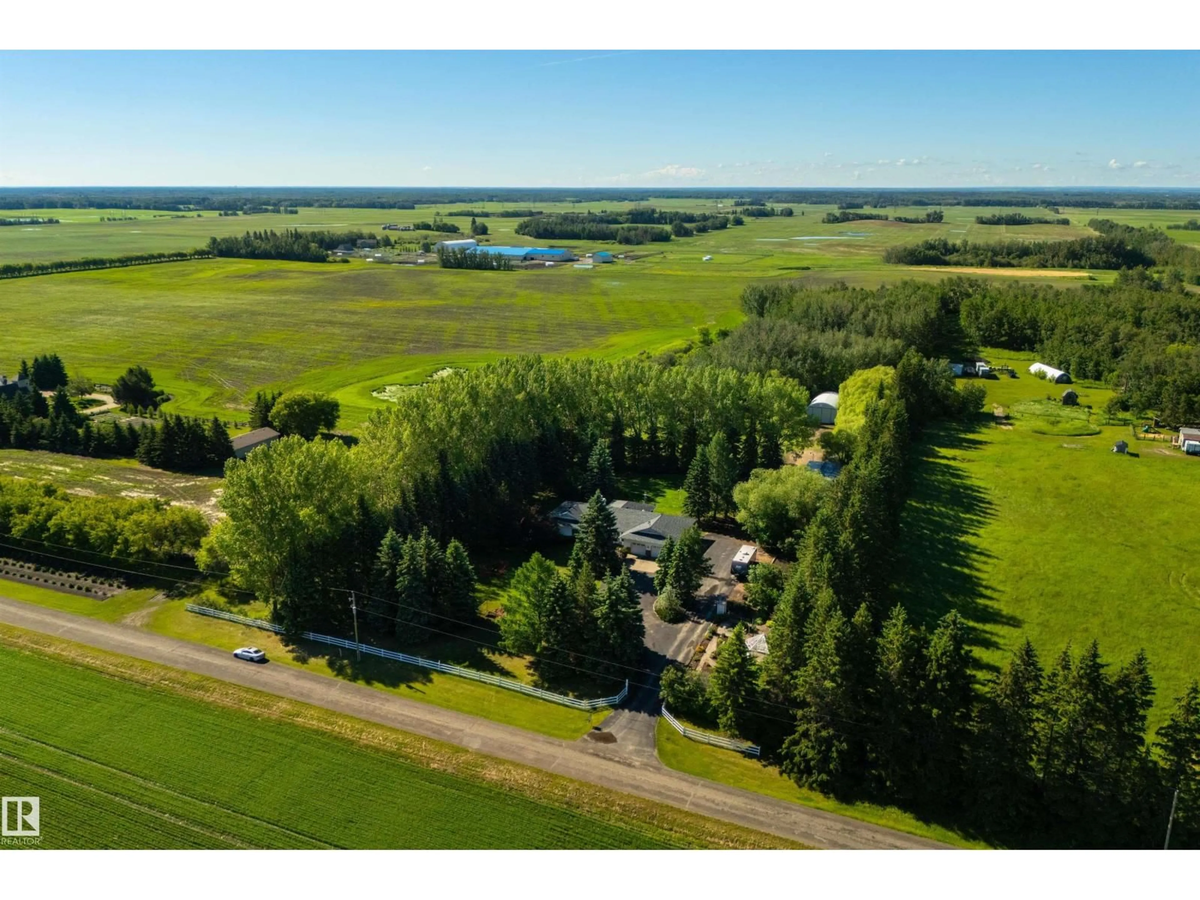 A pic from outside/outdoor area/front of a property/back of a property/a pic from drone, water/lake/river/ocean view for 27113 TWP ROAD 522, Rural Parkland County Alberta T7X3A8