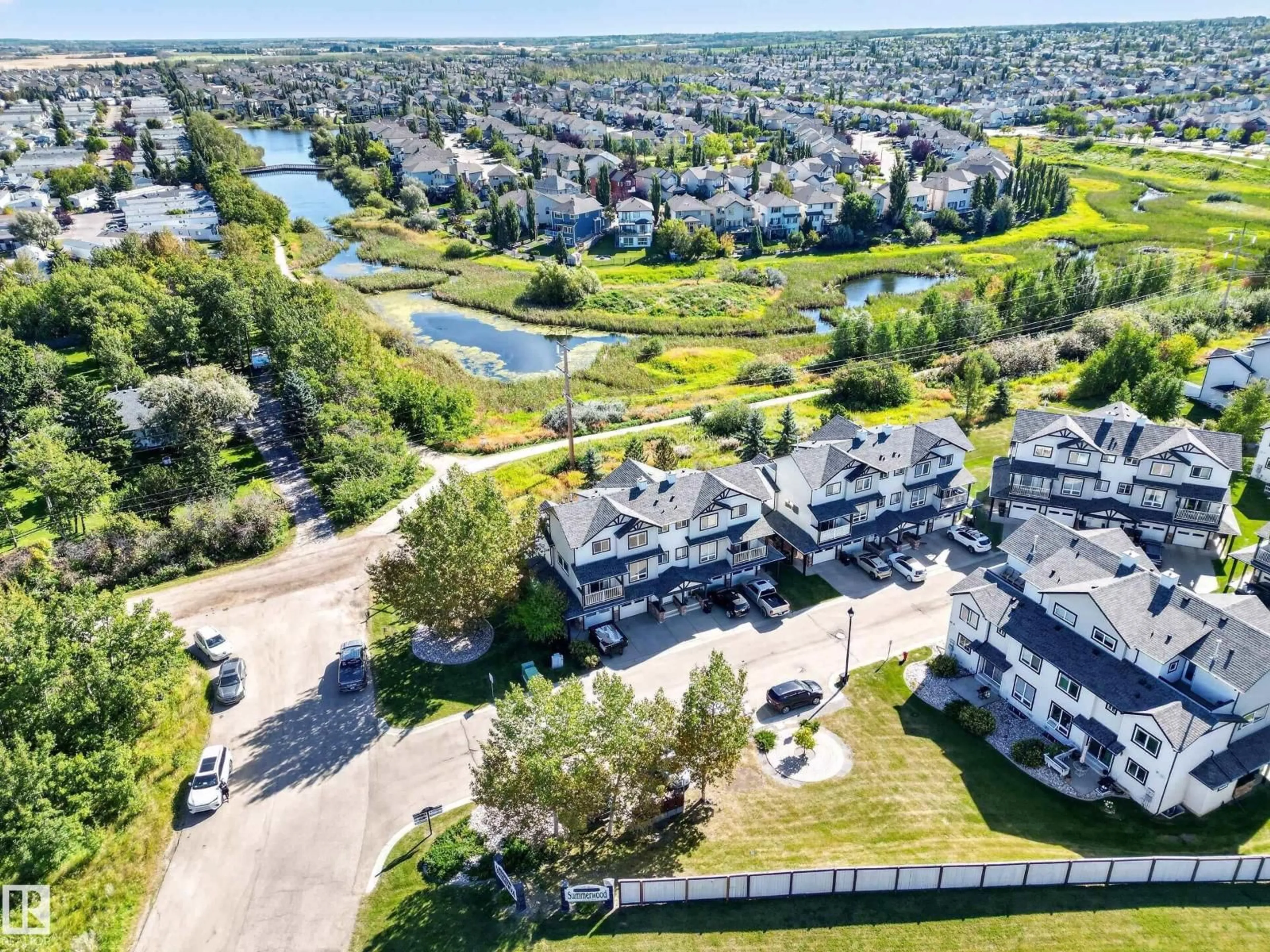 A pic from outside/outdoor area/front of a property/back of a property/a pic from drone, water/lake/river/ocean view for 11 - 3 CLOVER BAR LN, Sherwood Park Alberta T8H0C4