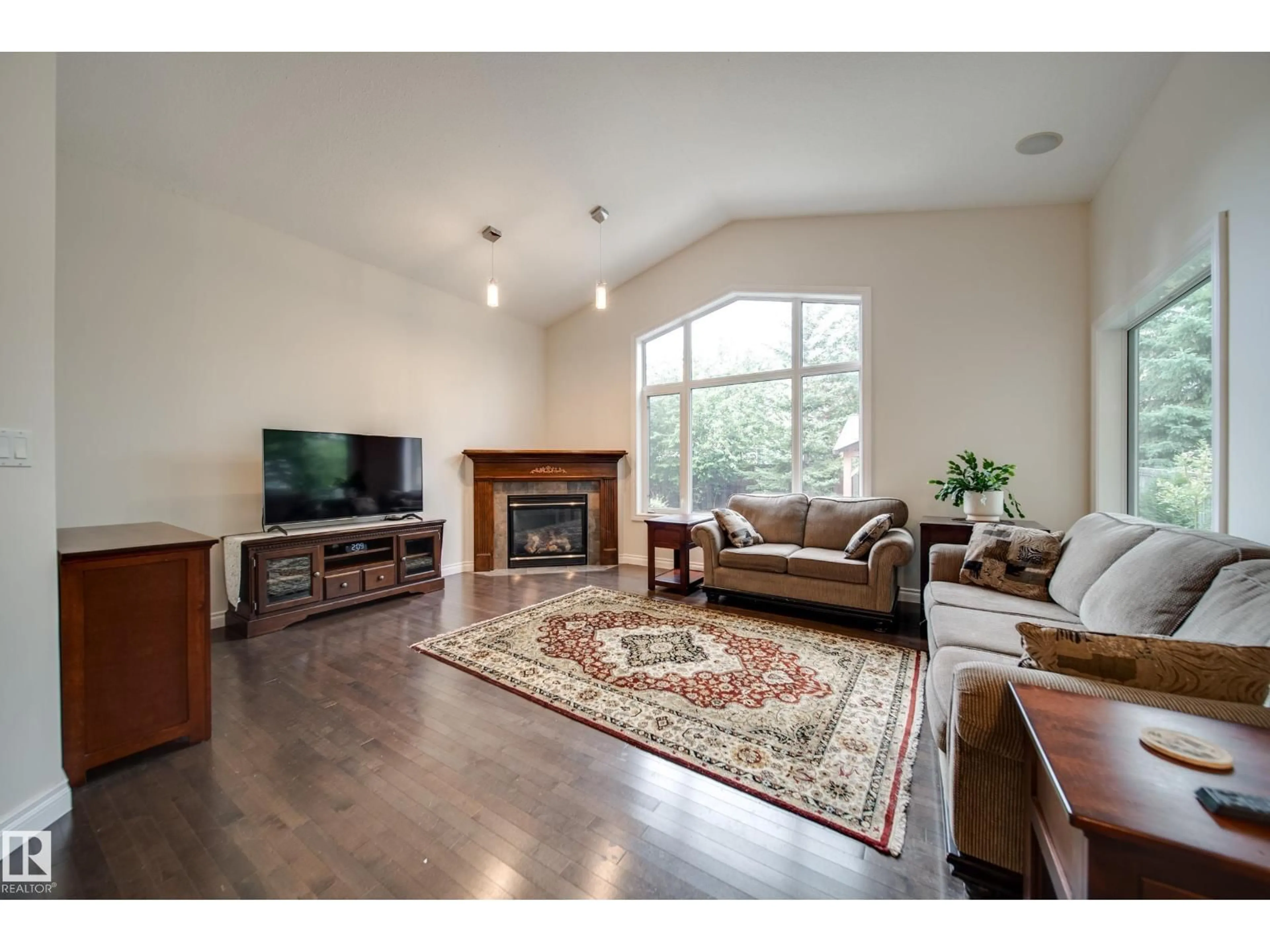Living room with furniture, wood/laminate floor for 2410 WARRY PL, Edmonton Alberta T6W0P1