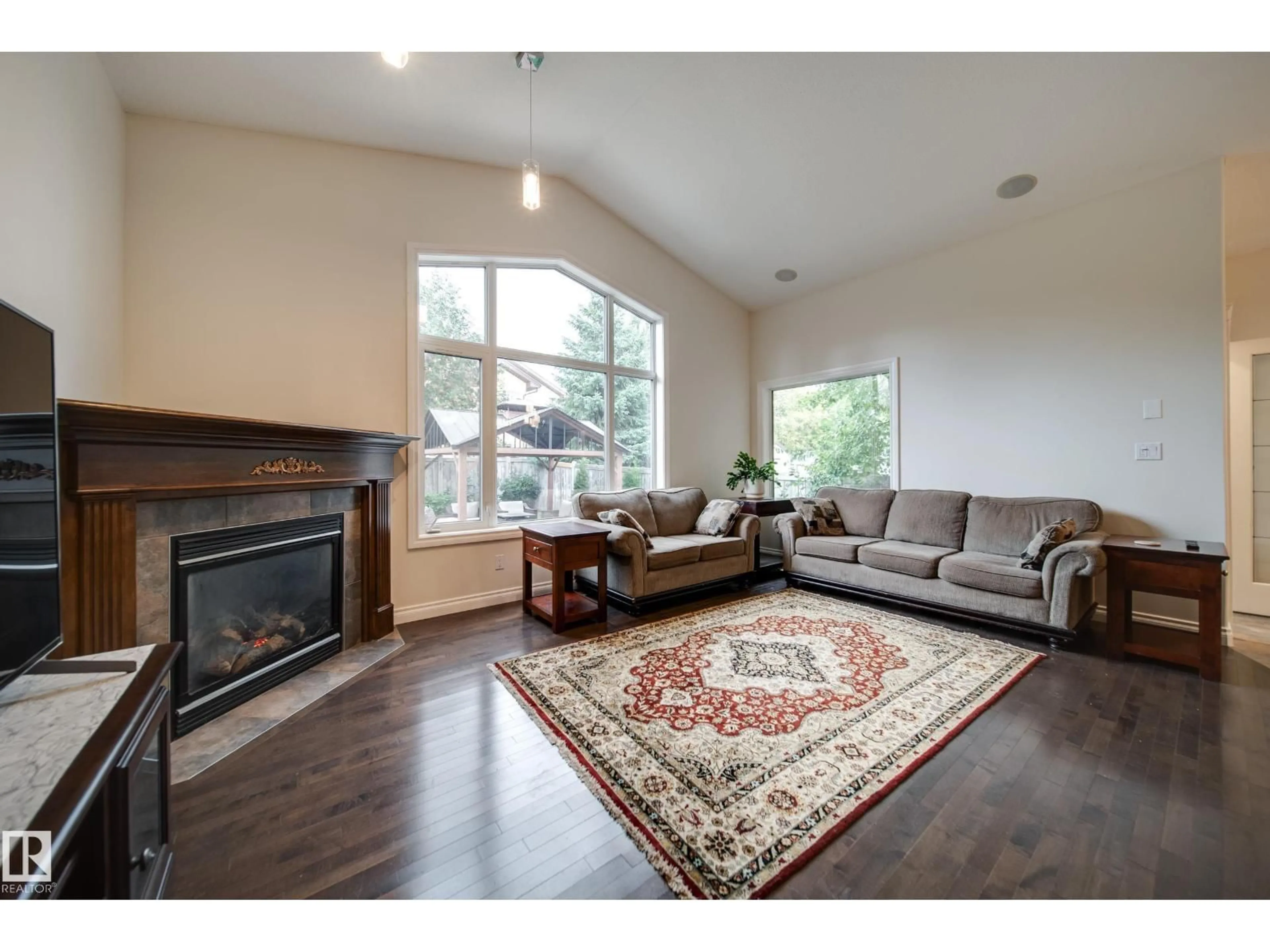 Living room with furniture, wood/laminate floor for 2410 WARRY PL, Edmonton Alberta T6W0P1