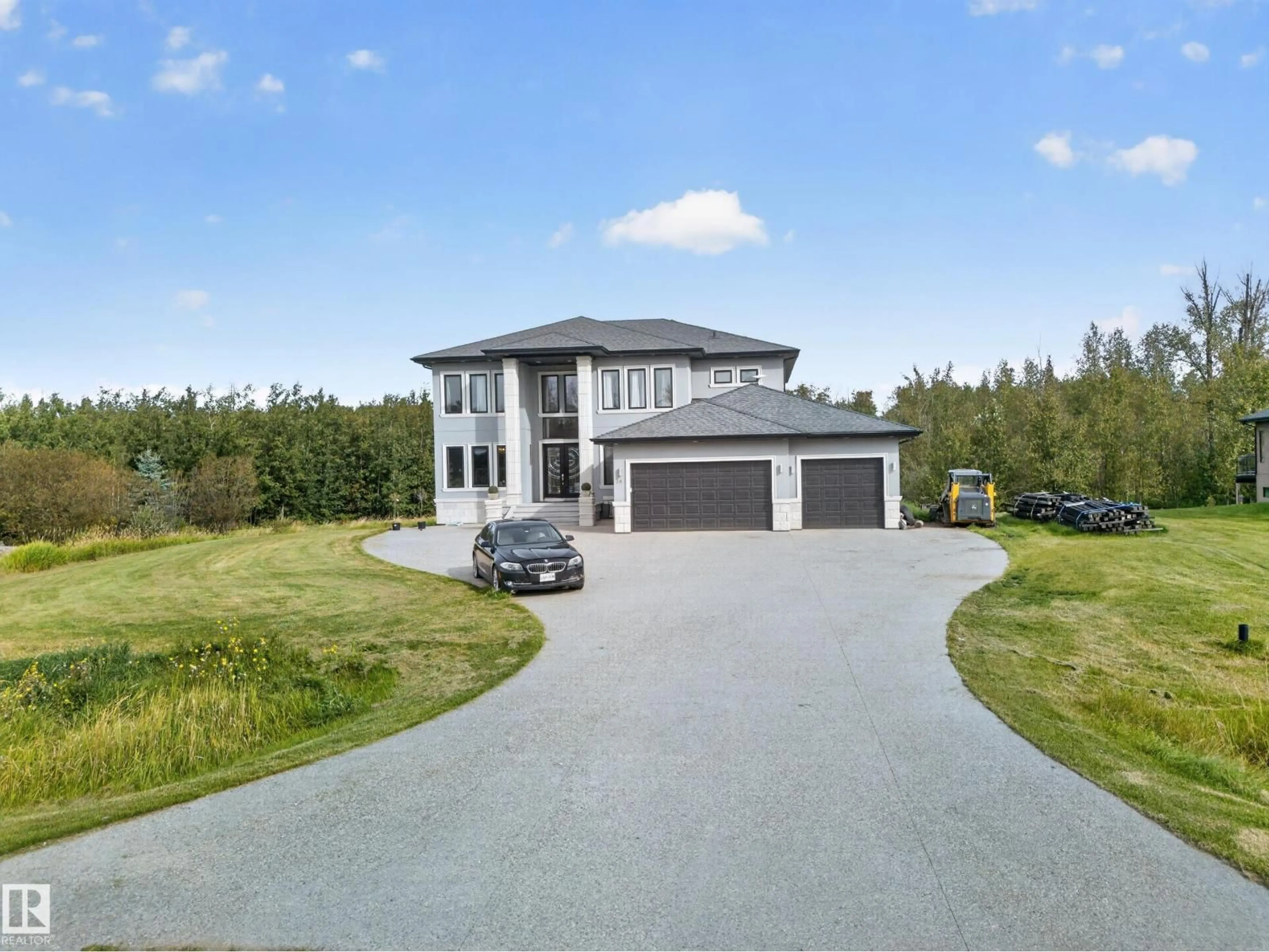 A pic from outside/outdoor area/front of a property/back of a property/a pic from drone, street for 24 26314 TWP ROAD 532 A, Rural Parkland County Alberta T7X4M1