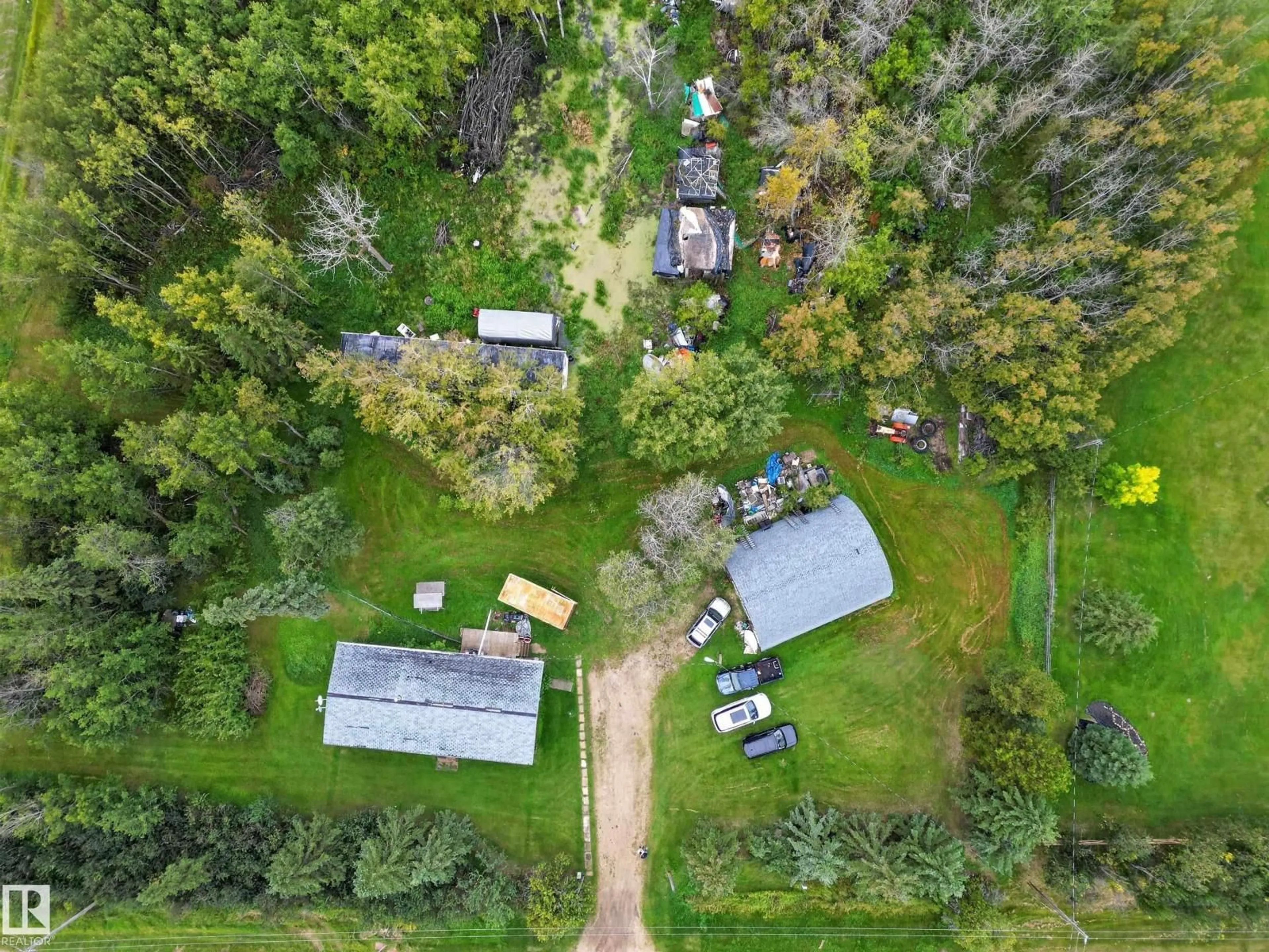A pic from outside/outdoor area/front of a property/back of a property/a pic from drone, forest/trees view for #2 - 21316 TWP ROAD 534, Rural Strathcona County Alberta T8G2B1
