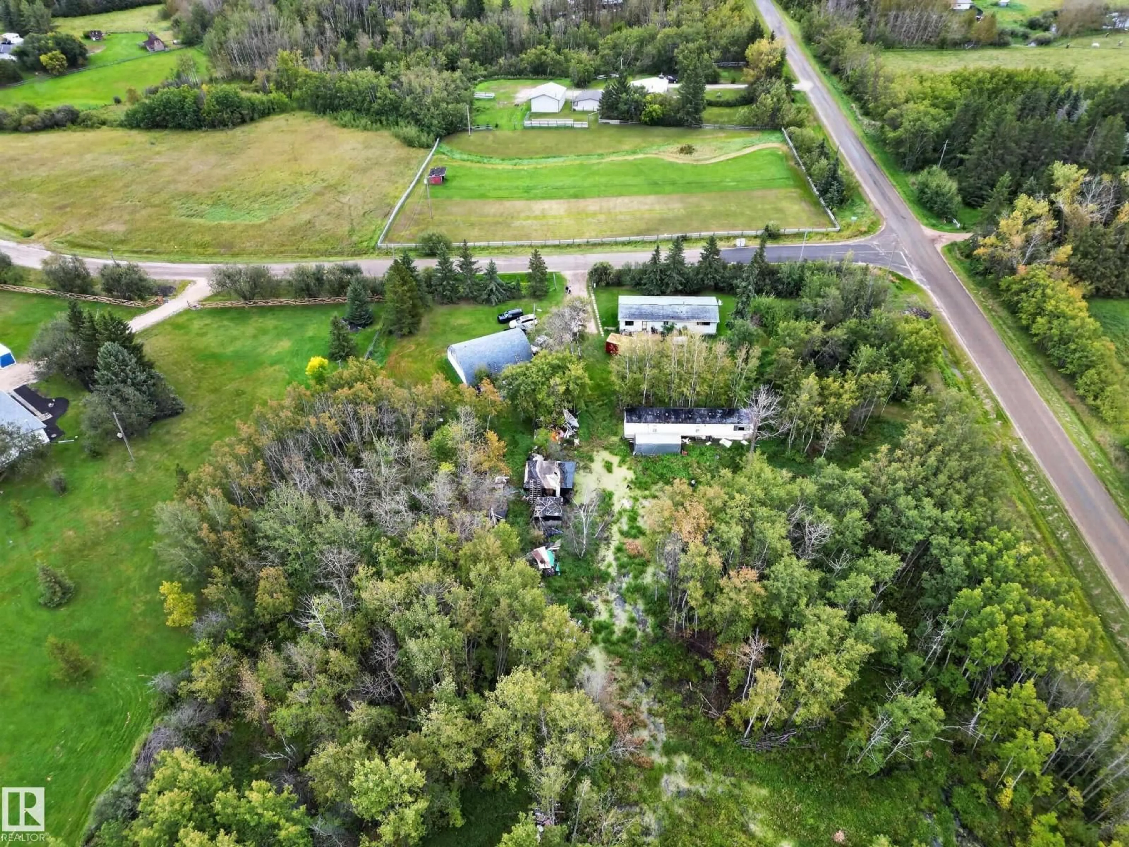 A pic from outside/outdoor area/front of a property/back of a property/a pic from drone, forest/trees view for #2 - 21316 TWP ROAD 534, Rural Strathcona County Alberta T8G2B1