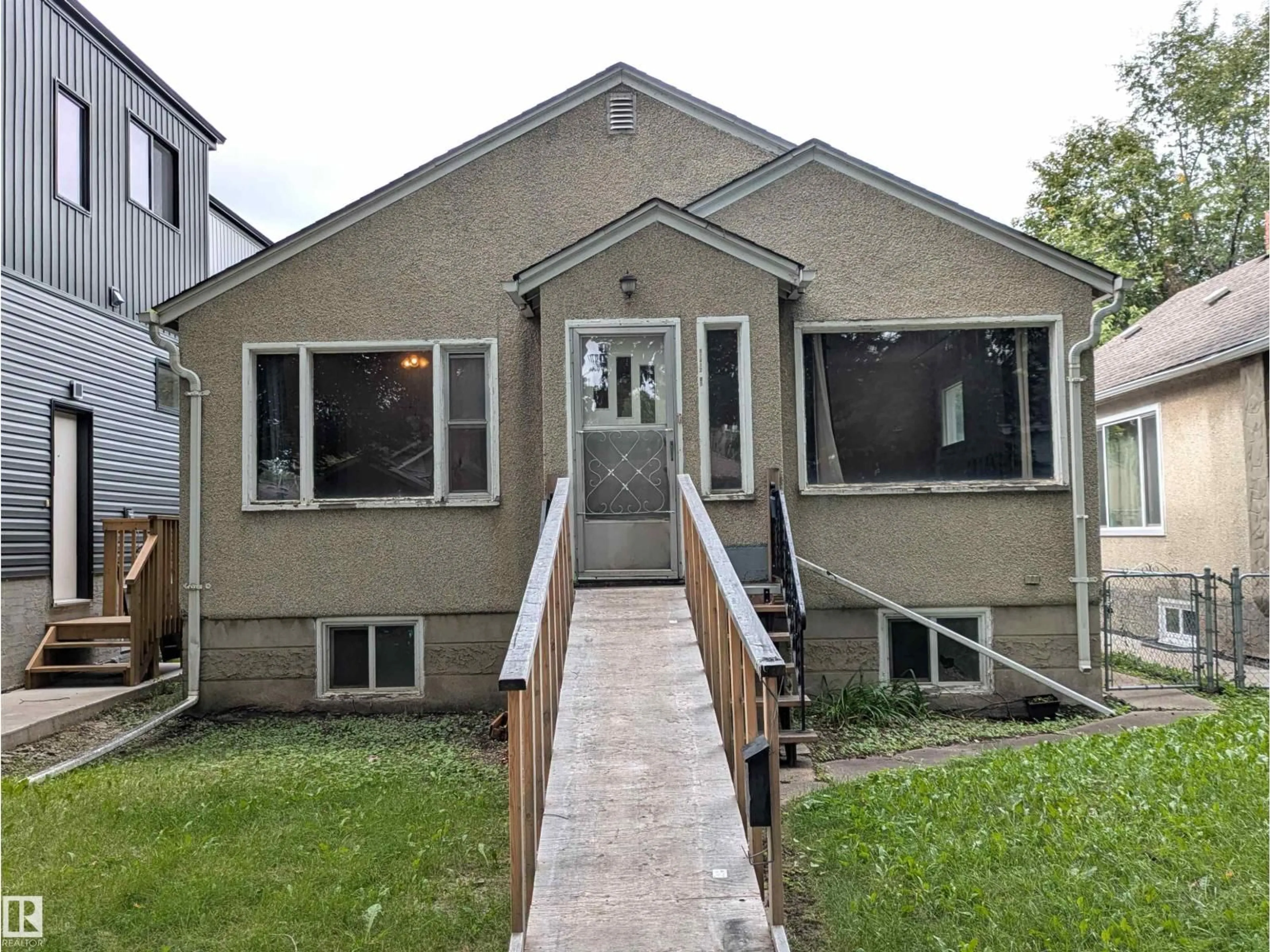 Home with vinyl exterior material, street for NW - 11412 85 ST, Edmonton Alberta T5B3C9