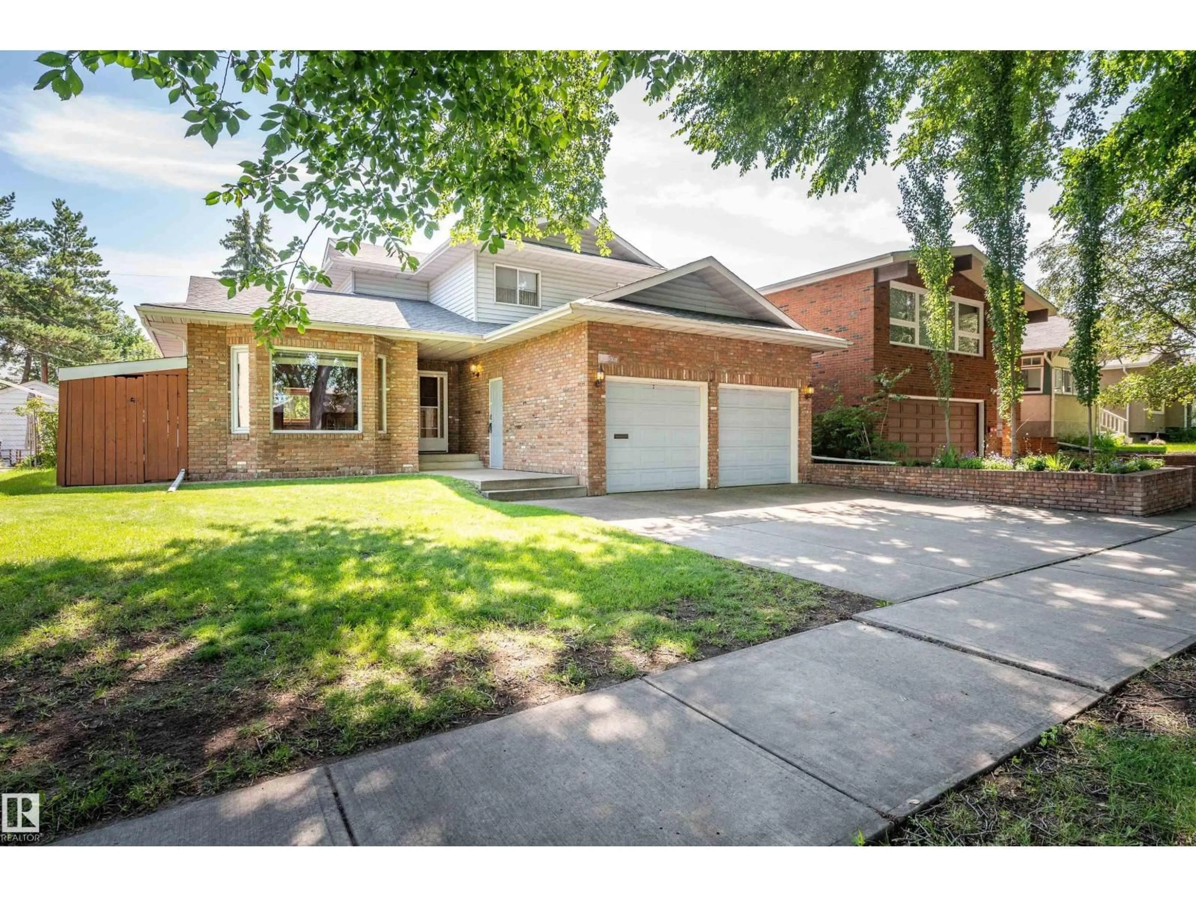 Home with brick exterior material, street for NW - 10155 74 ST, Edmonton Alberta T6A2X8