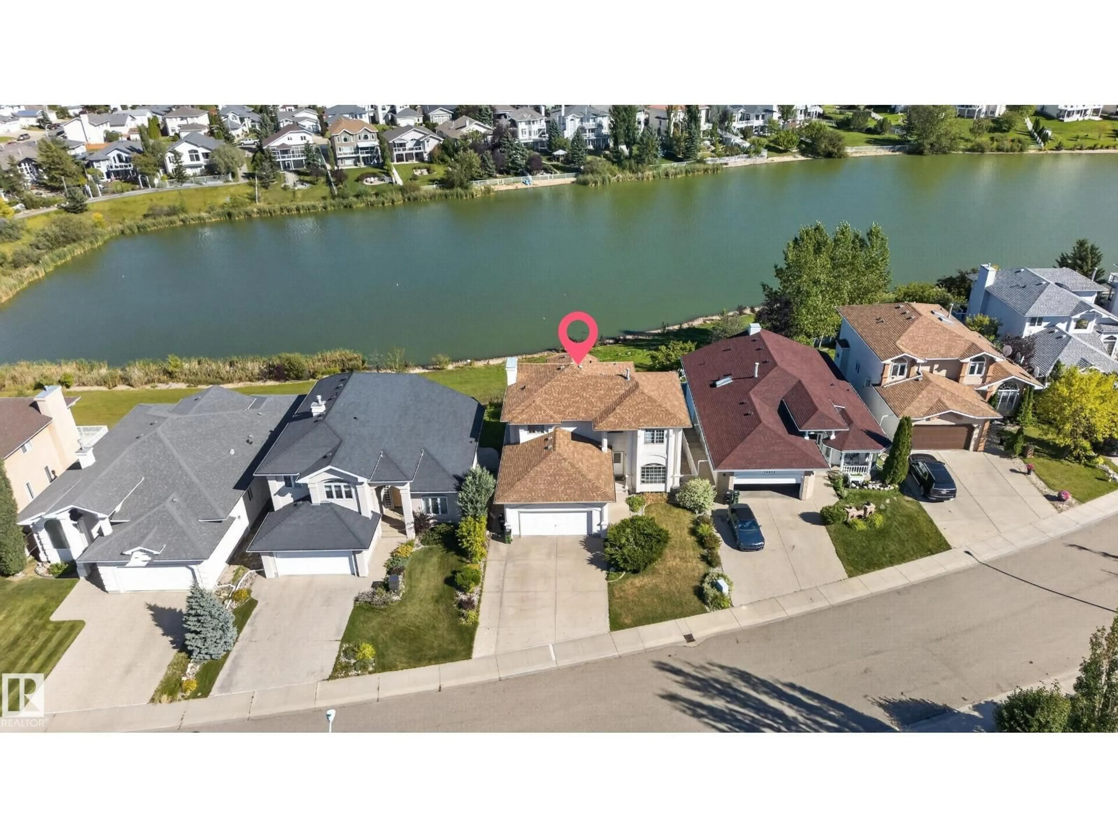 A pic from outside/outdoor area/front of a property/back of a property/a pic from drone, water/lake/river/ocean view for 15819 58 ST, Edmonton Alberta T5Y2R4