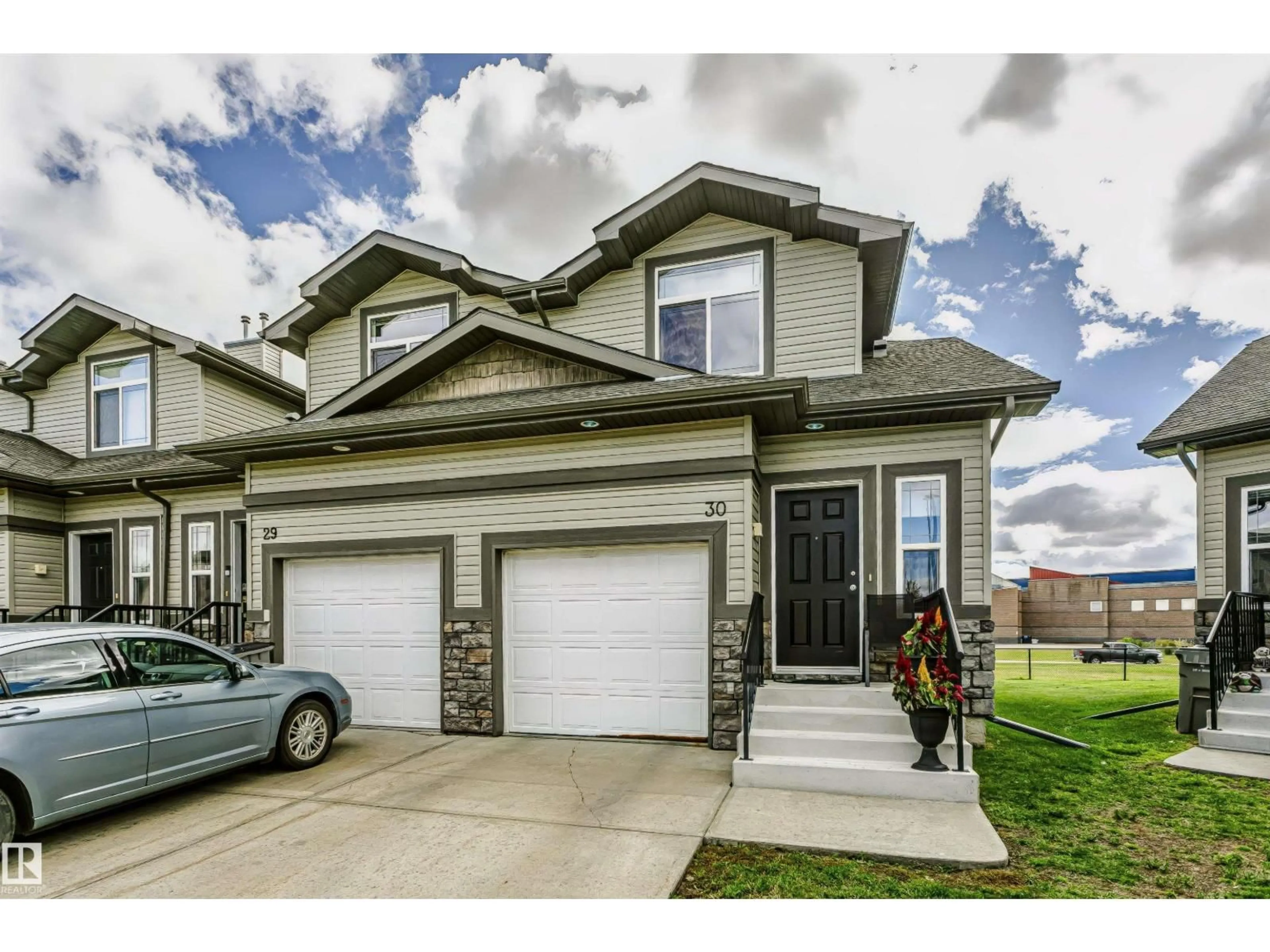 Home with vinyl exterior material, street for 30 - 9511 102 AV, Morinville Alberta T8R0C6