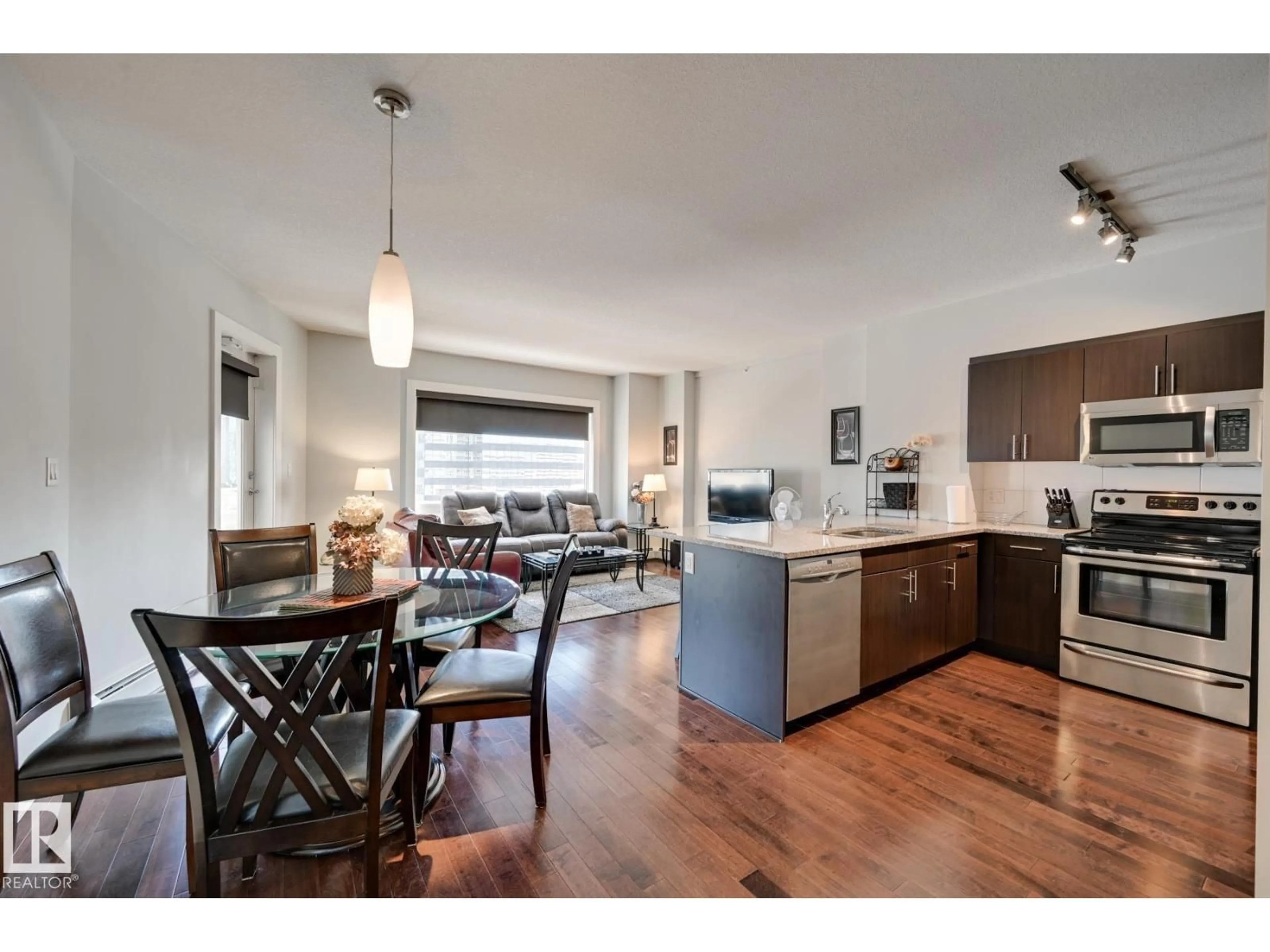 Open concept kitchen, wood/laminate floor for #802 - 10152 104 ST NW, Edmonton Alberta T5J0B6