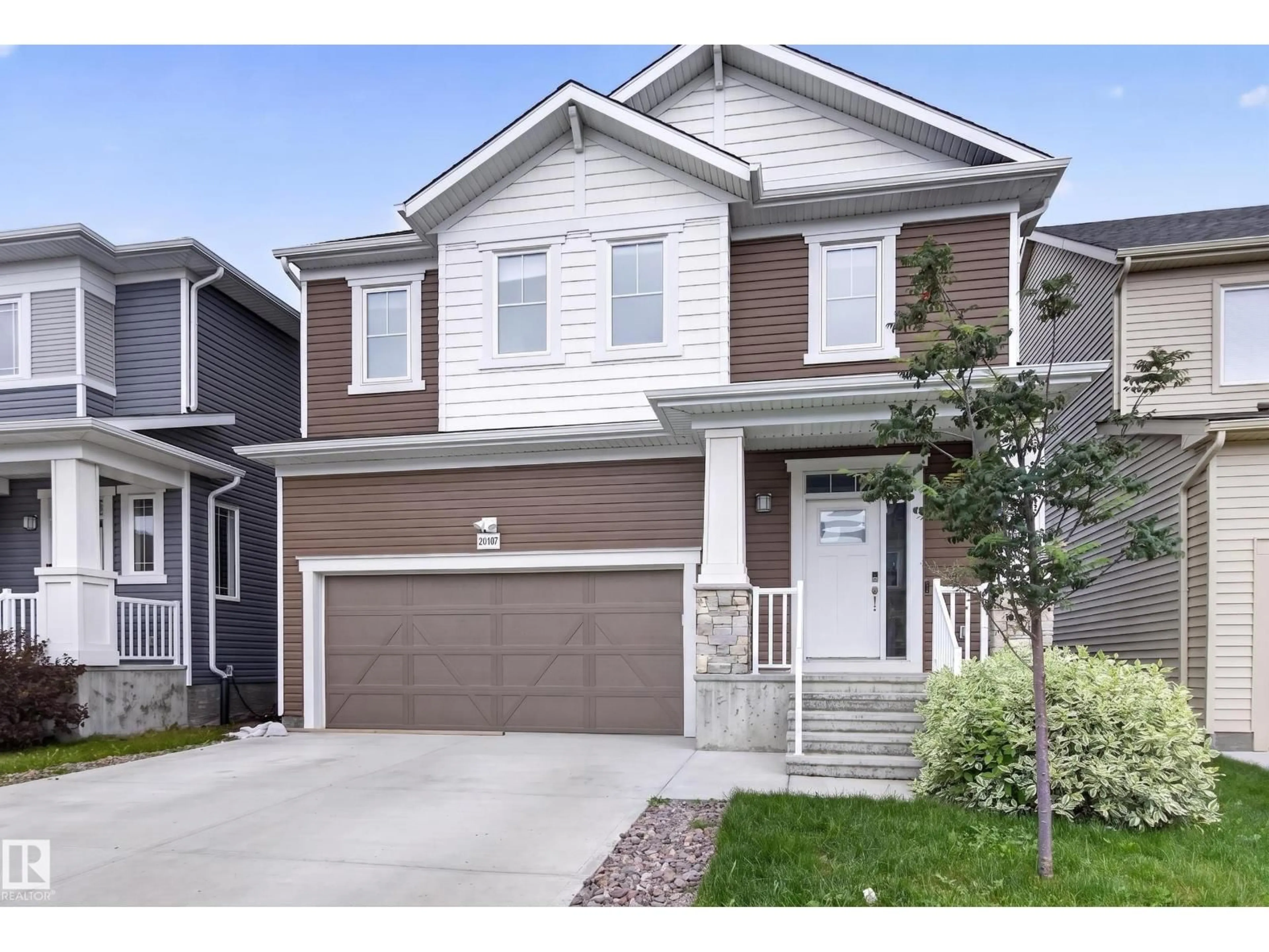 Home with vinyl exterior material, street for 20107 15 AV, Edmonton Alberta T6M1L6