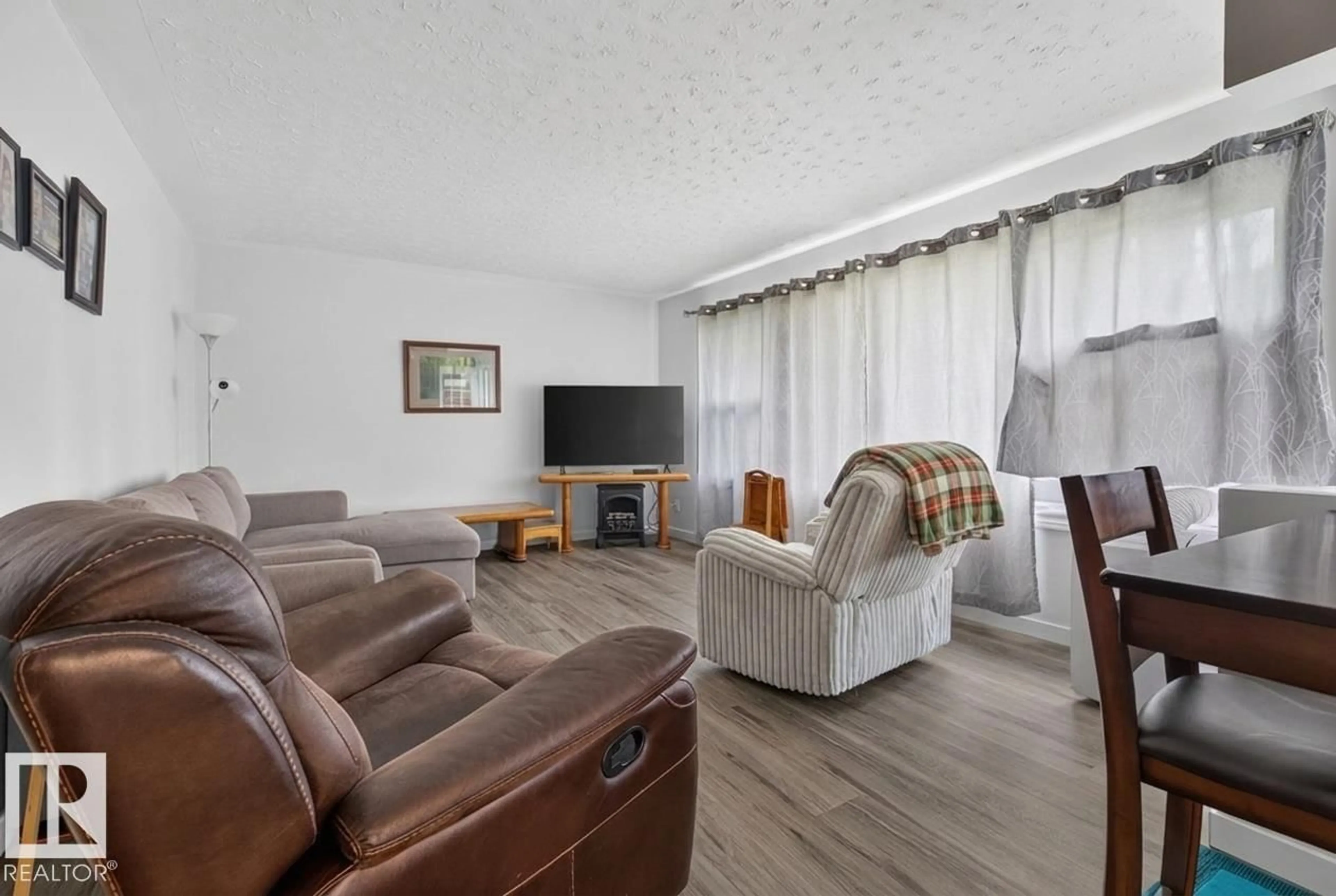 Living room with furniture, unknown for 15711 84 AV, Edmonton Alberta T5R3Y2
