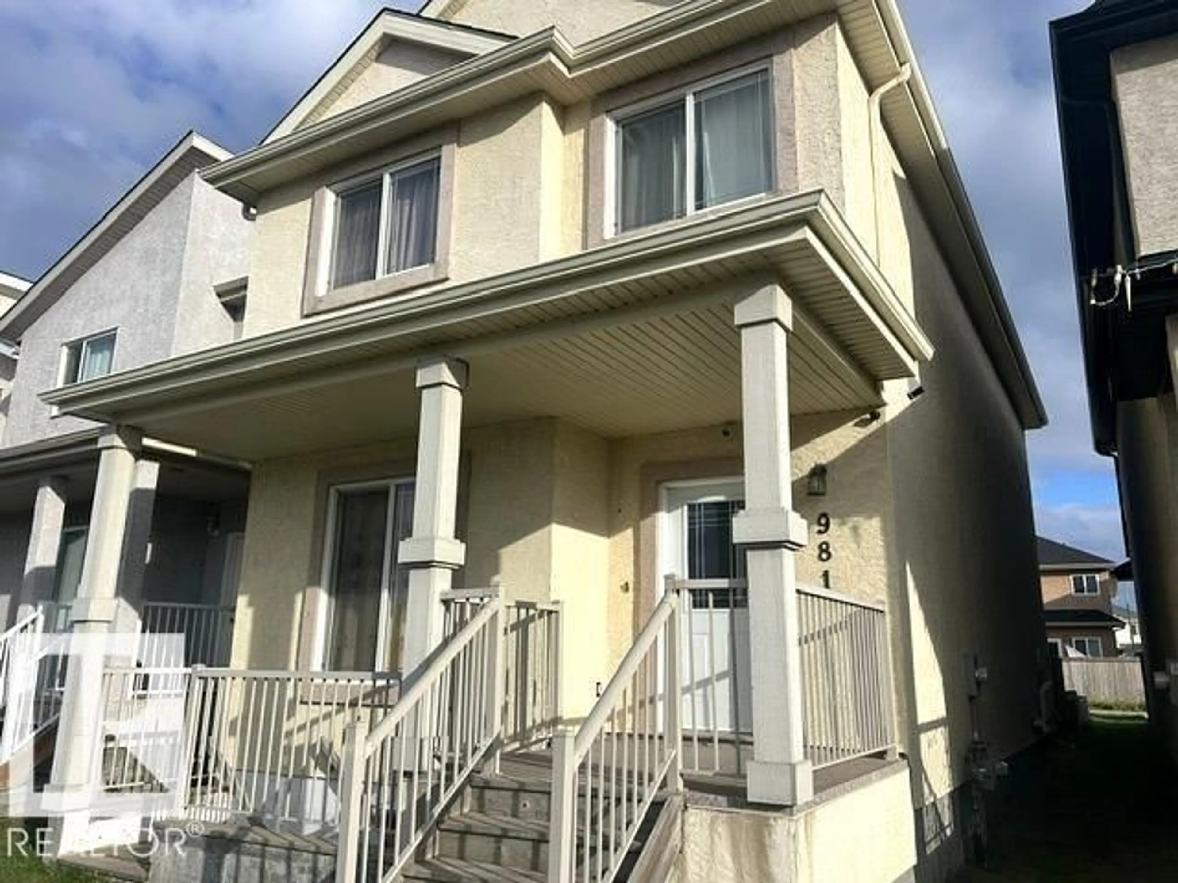Home with vinyl exterior material, street for 981 MCCONACHIE BV, Edmonton Alberta T5Y3N3