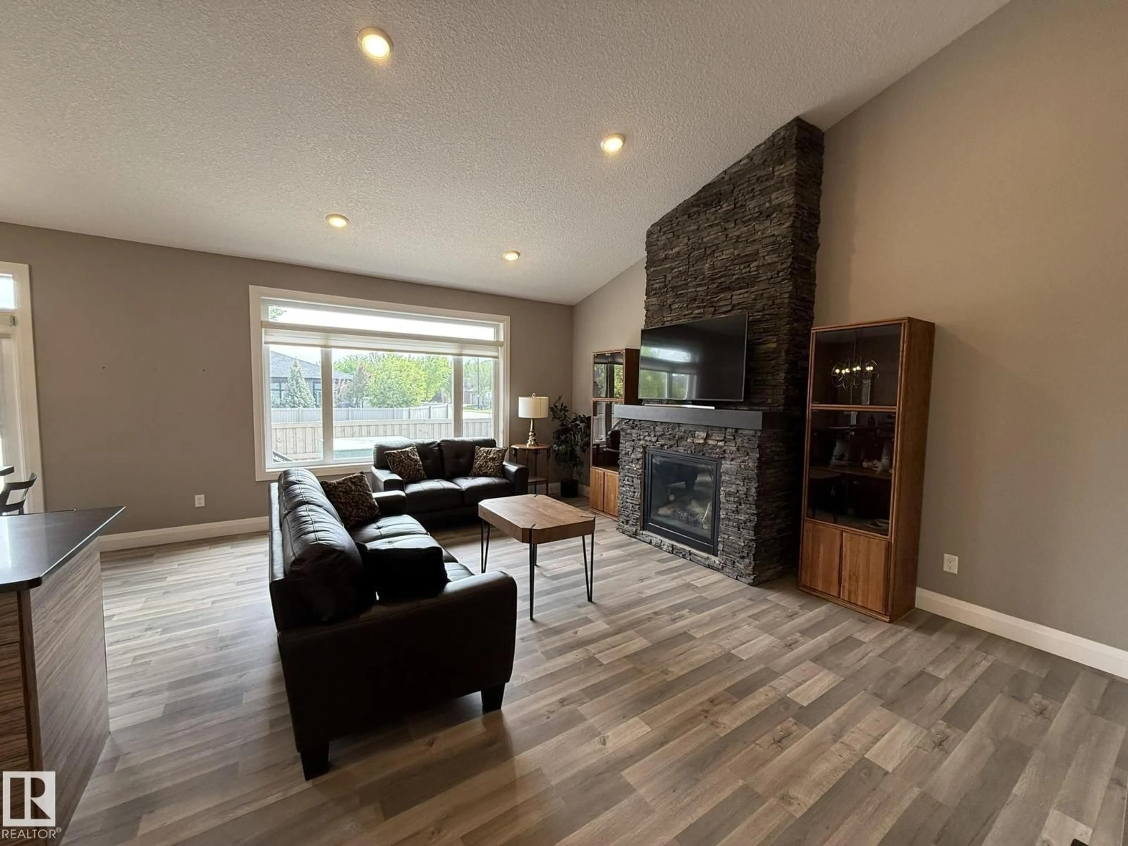 Living room with furniture, wood/laminate floor for #2 - 104 ALLARD LINK LI, Edmonton Alberta T6W2N2