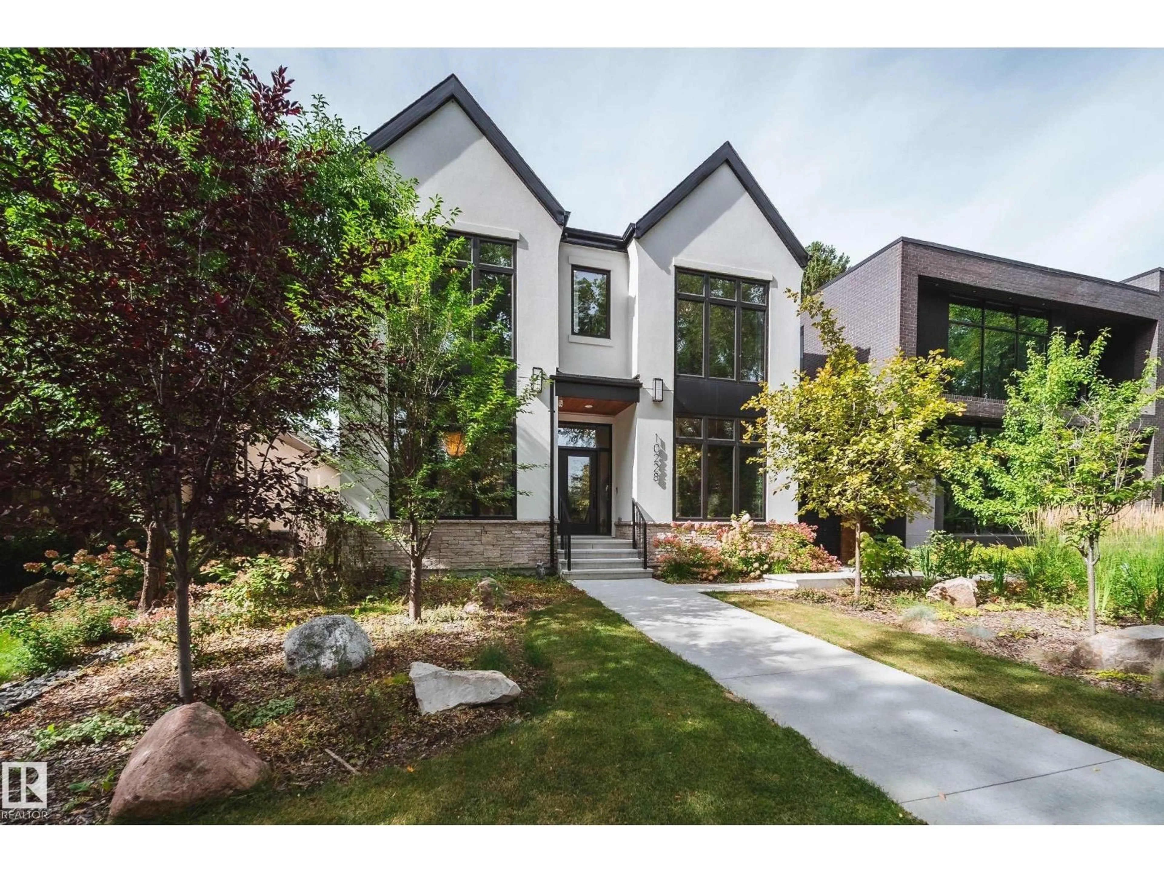 Home with brick exterior material, street for NW - 10228 130 ST, Edmonton Alberta T5N1X5