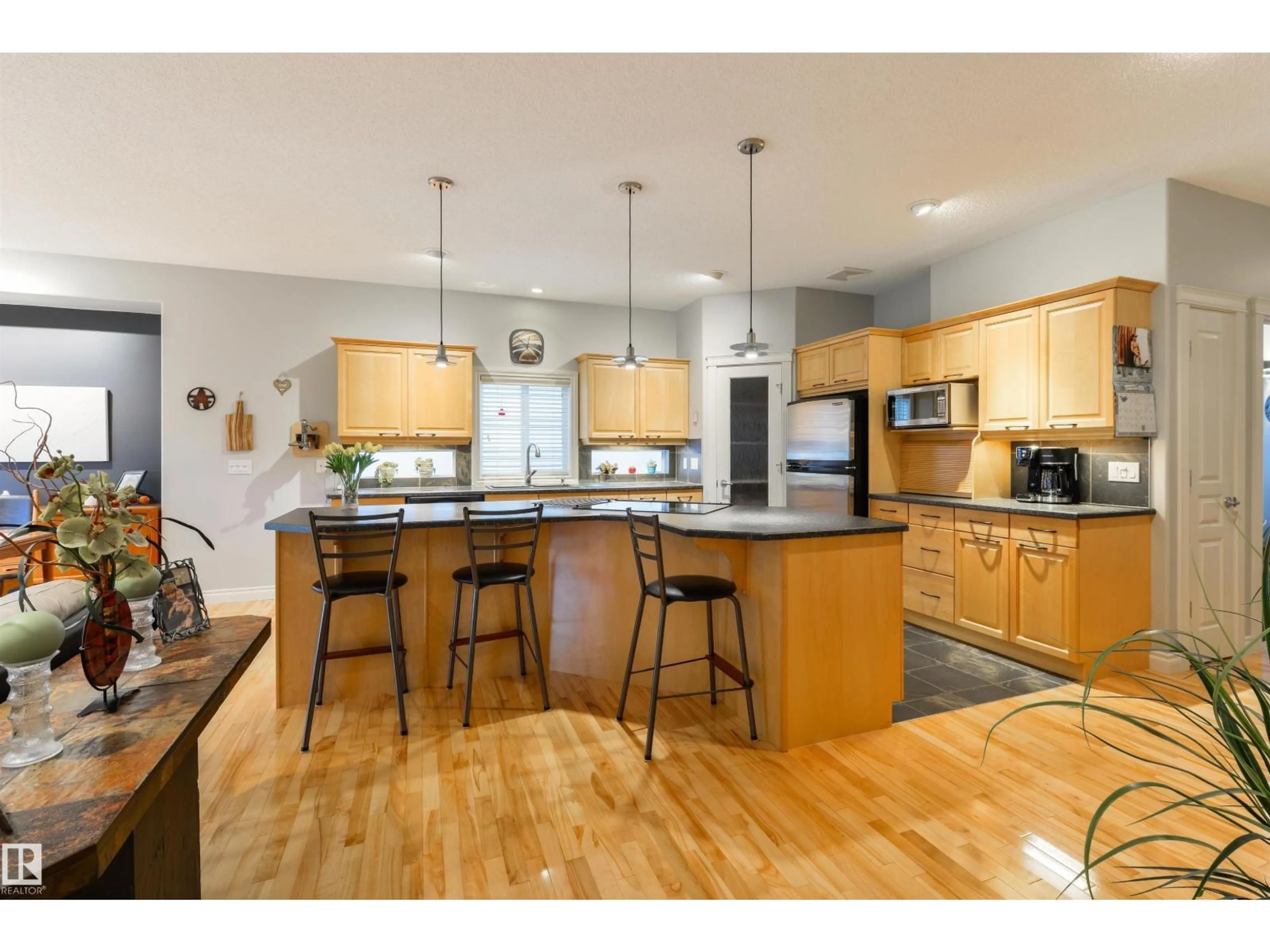 Open concept kitchen, wood/laminate floor for 16 LONGVIEW CL, Spruce Grove Alberta T7X4L7