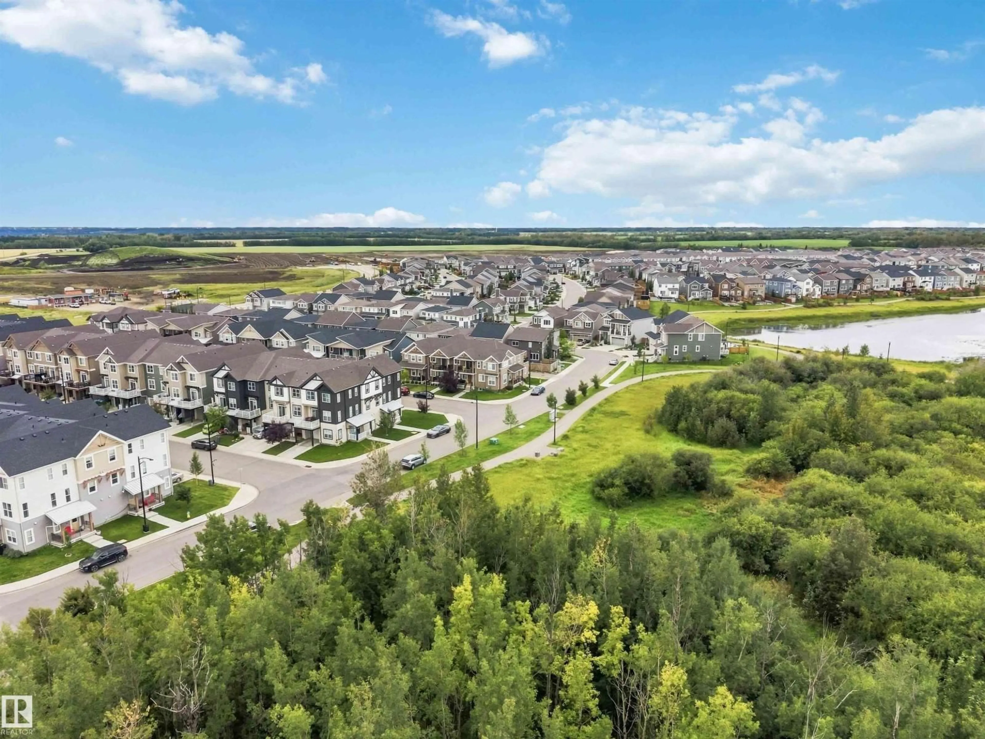 A pic from outside/outdoor area/front of a property/back of a property/a pic from drone, water/lake/river/ocean view for 20127 19 AV, Edmonton Alberta T6M0X9