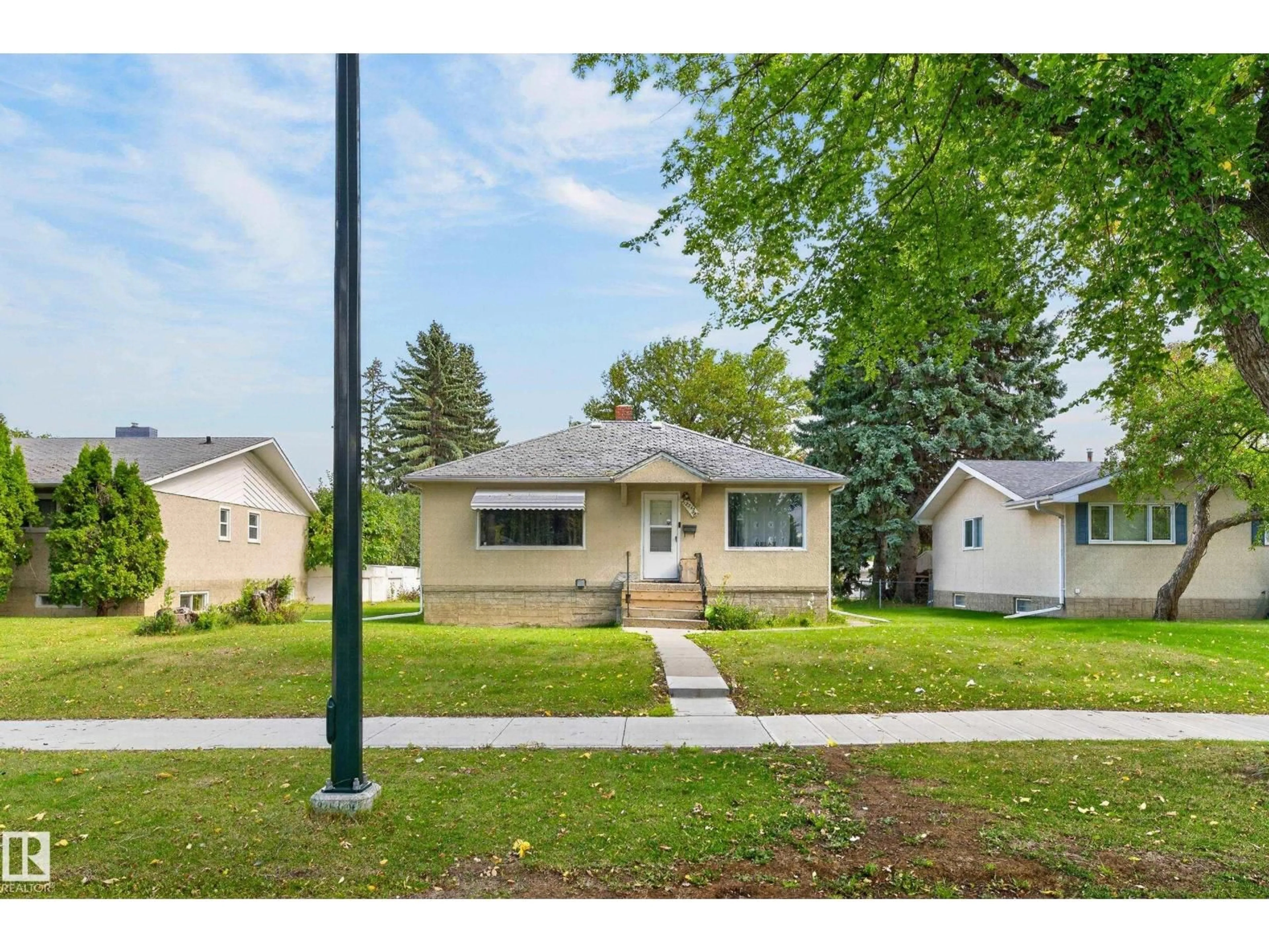 Home with vinyl exterior material, street for NW - 12345 79 ST, Edmonton Alberta T5B2L9