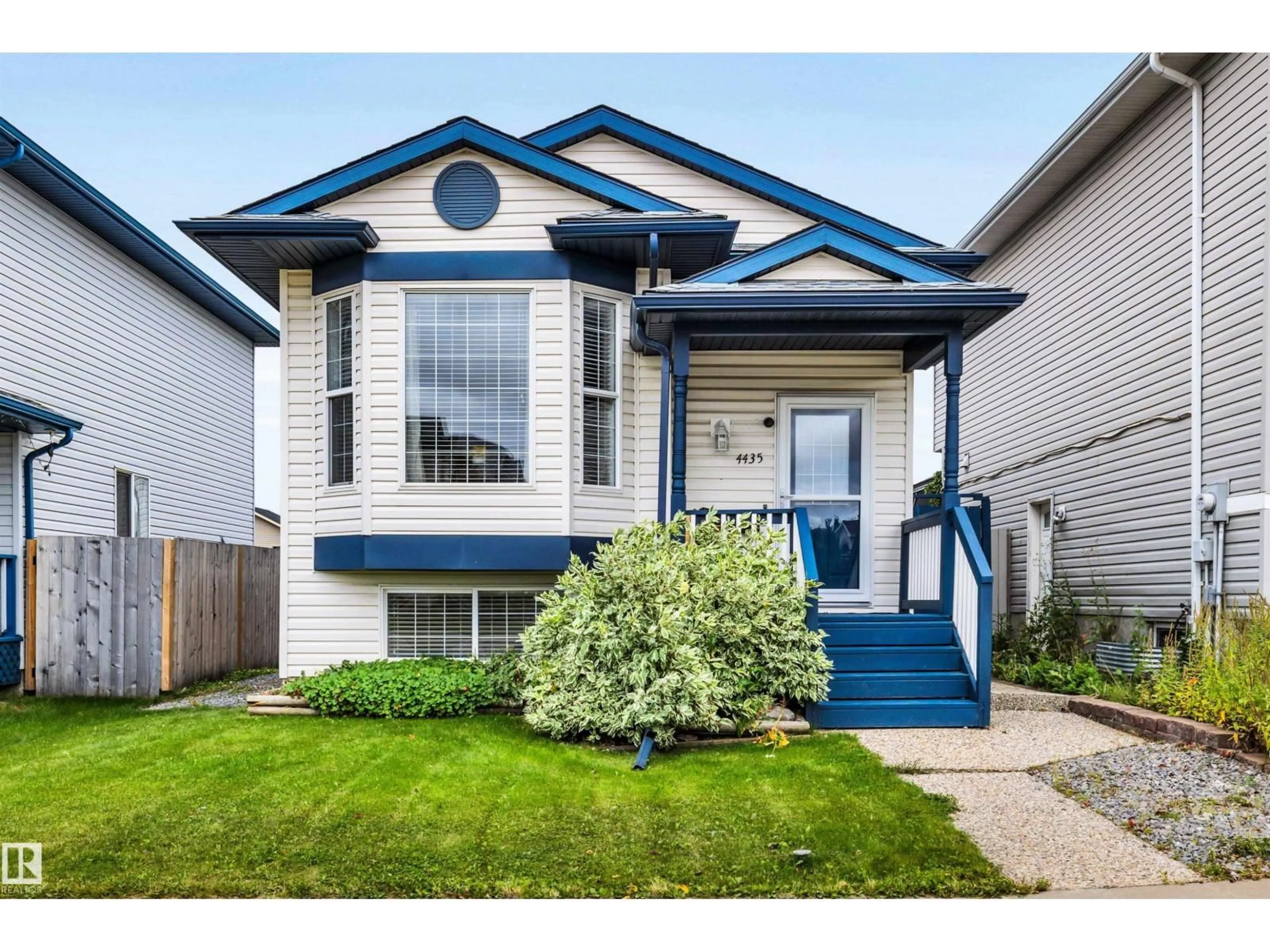 Home with vinyl exterior material, street for 4435 152 AV, Edmonton Alberta T5Y3C3