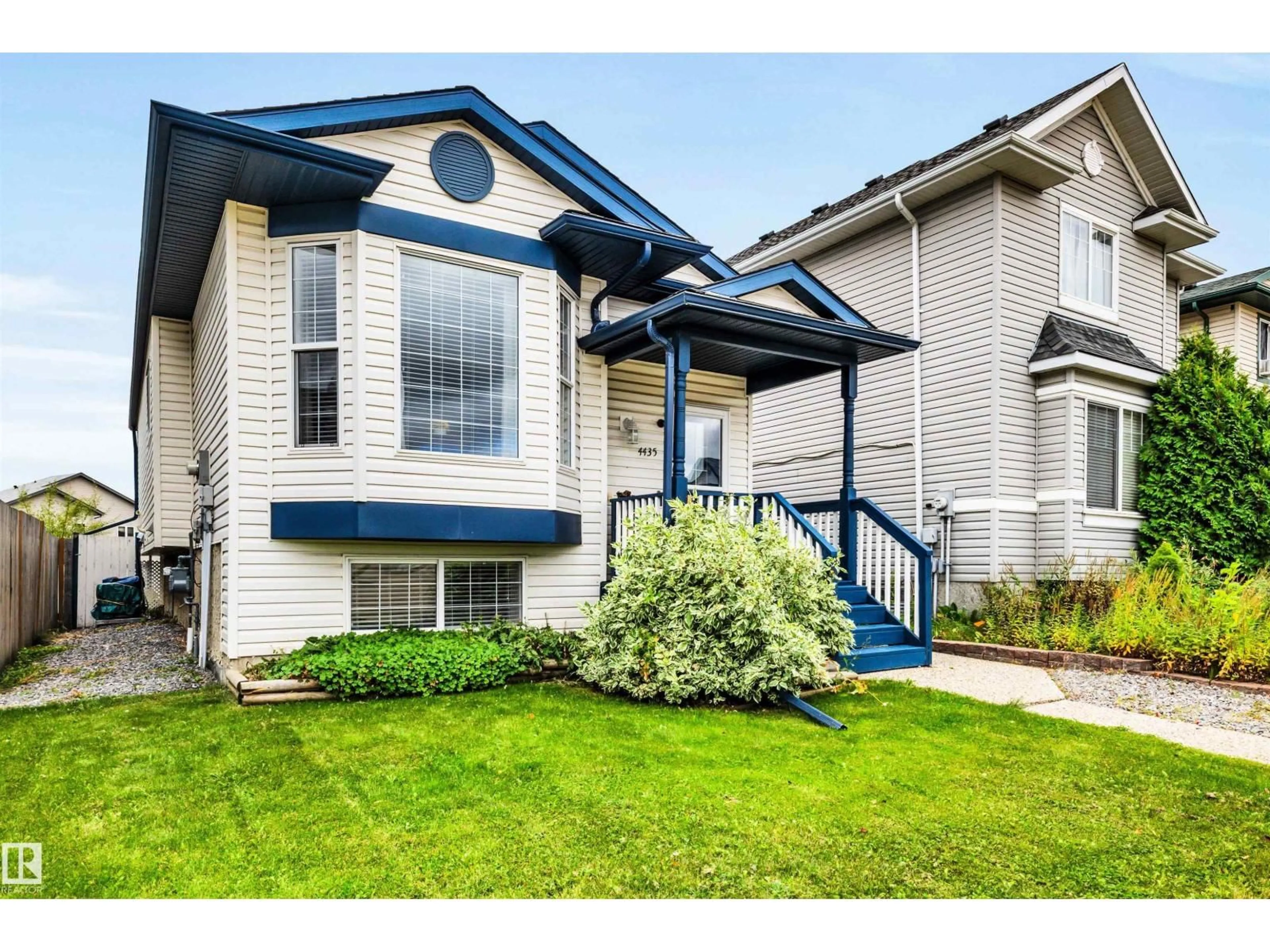 Home with vinyl exterior material, street for 4435 152 AV, Edmonton Alberta T5Y3C3