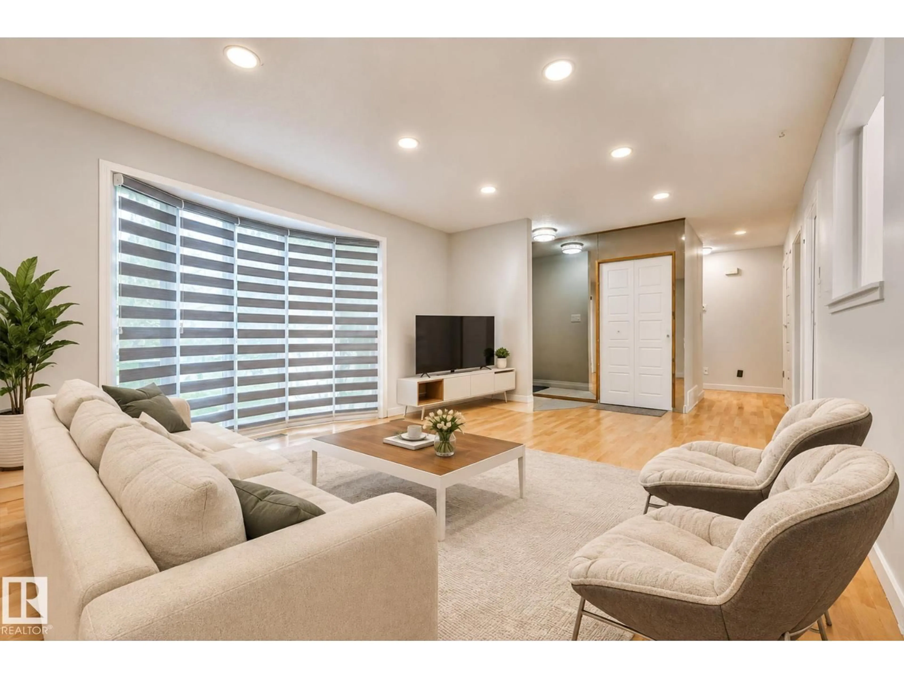 Living room with furniture, wood/laminate floor for 4324 70 ST, Edmonton Alberta T6K0V1