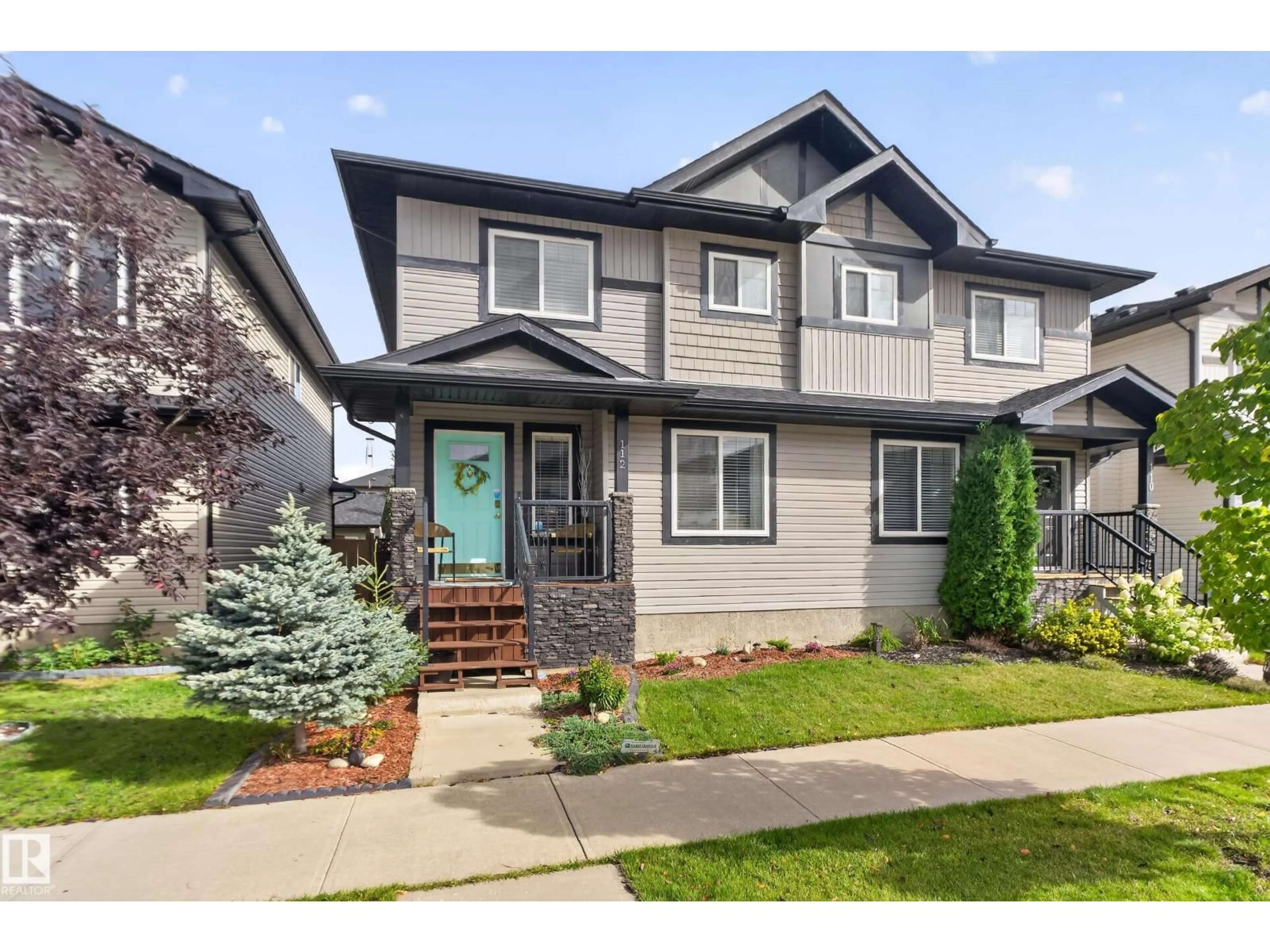 Home with vinyl exterior material, street for 112 RICHMOND LI, Fort Saskatchewan Alberta T8L0S6