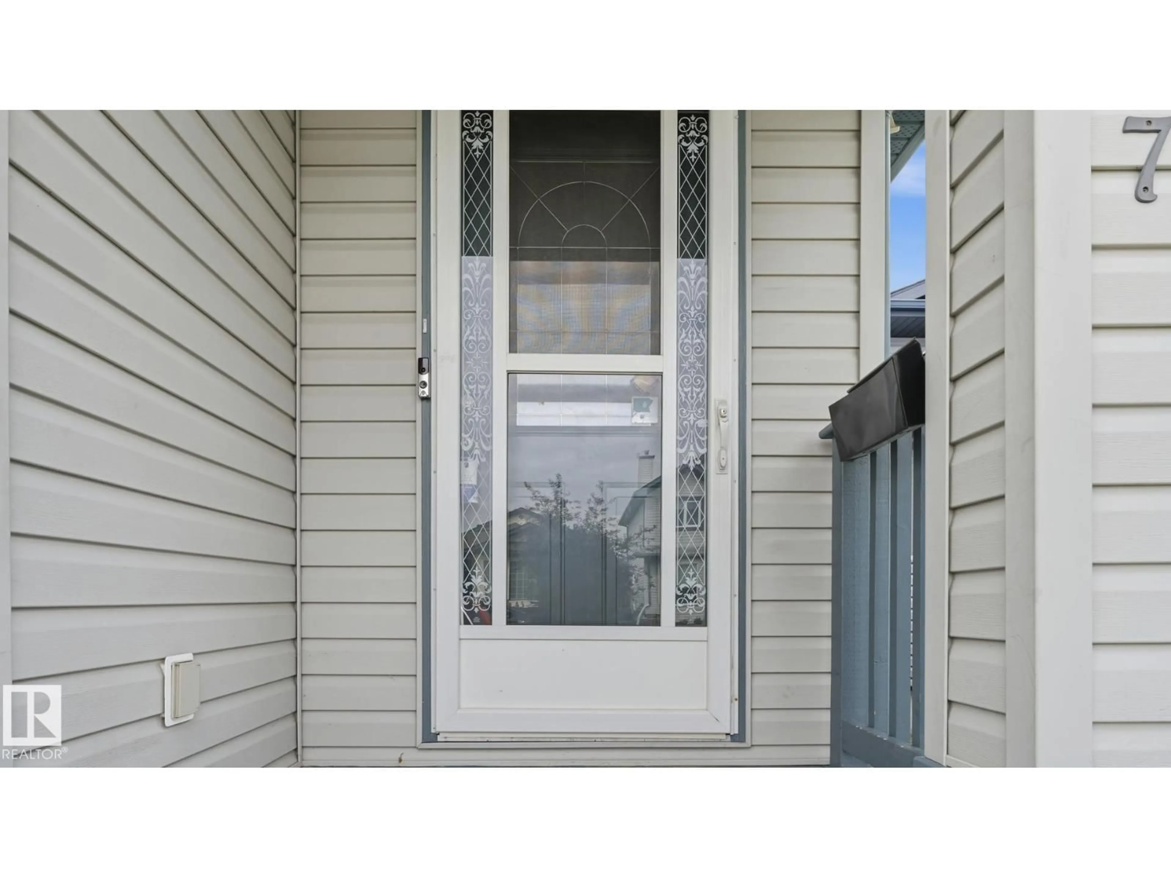 Home with vinyl exterior material, street for 2117 36 AV, Edmonton Alberta T6T1S3