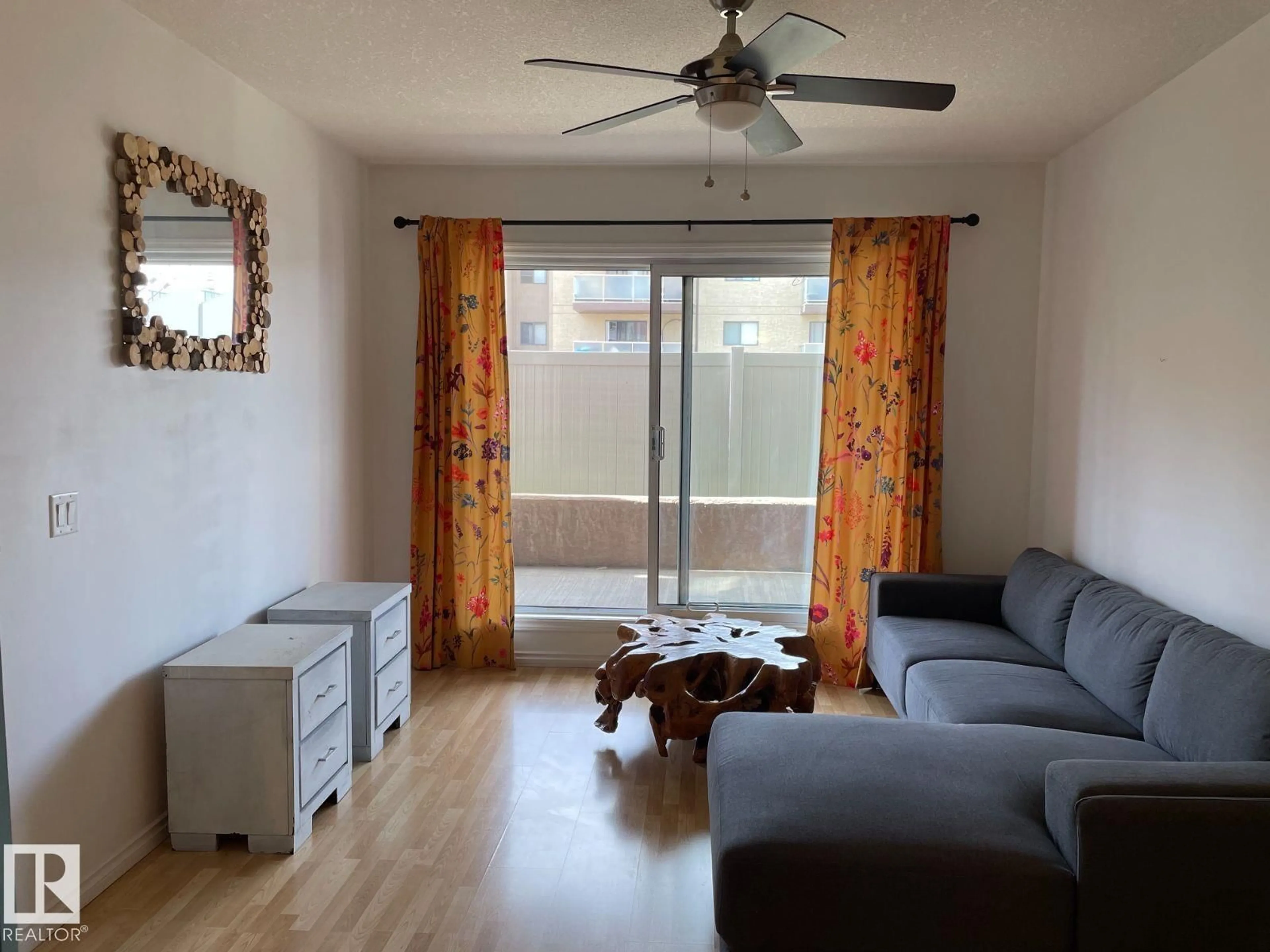Living room with furniture, wood/laminate floor for #103 - 10346 117 ST, Edmonton Alberta T5K2Y7