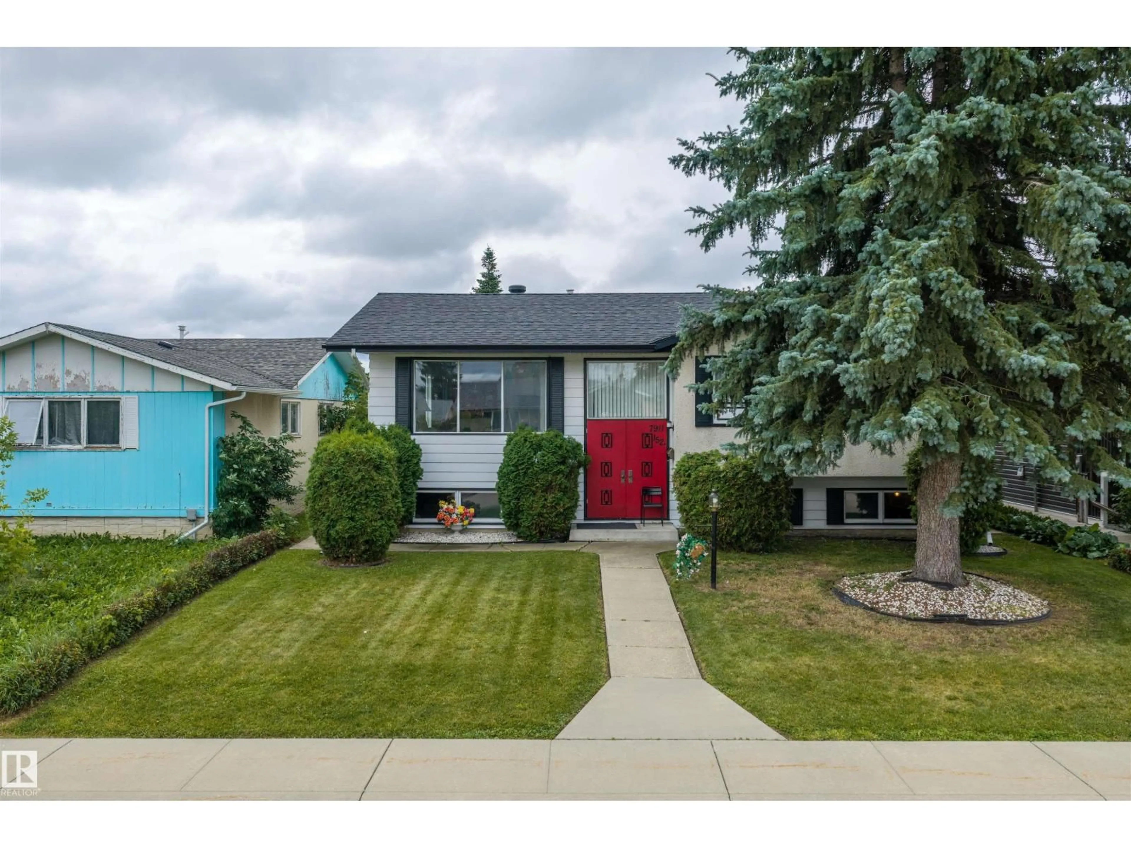 Home with vinyl exterior material, street for 7911 152A AV, Edmonton Alberta T5C3A1