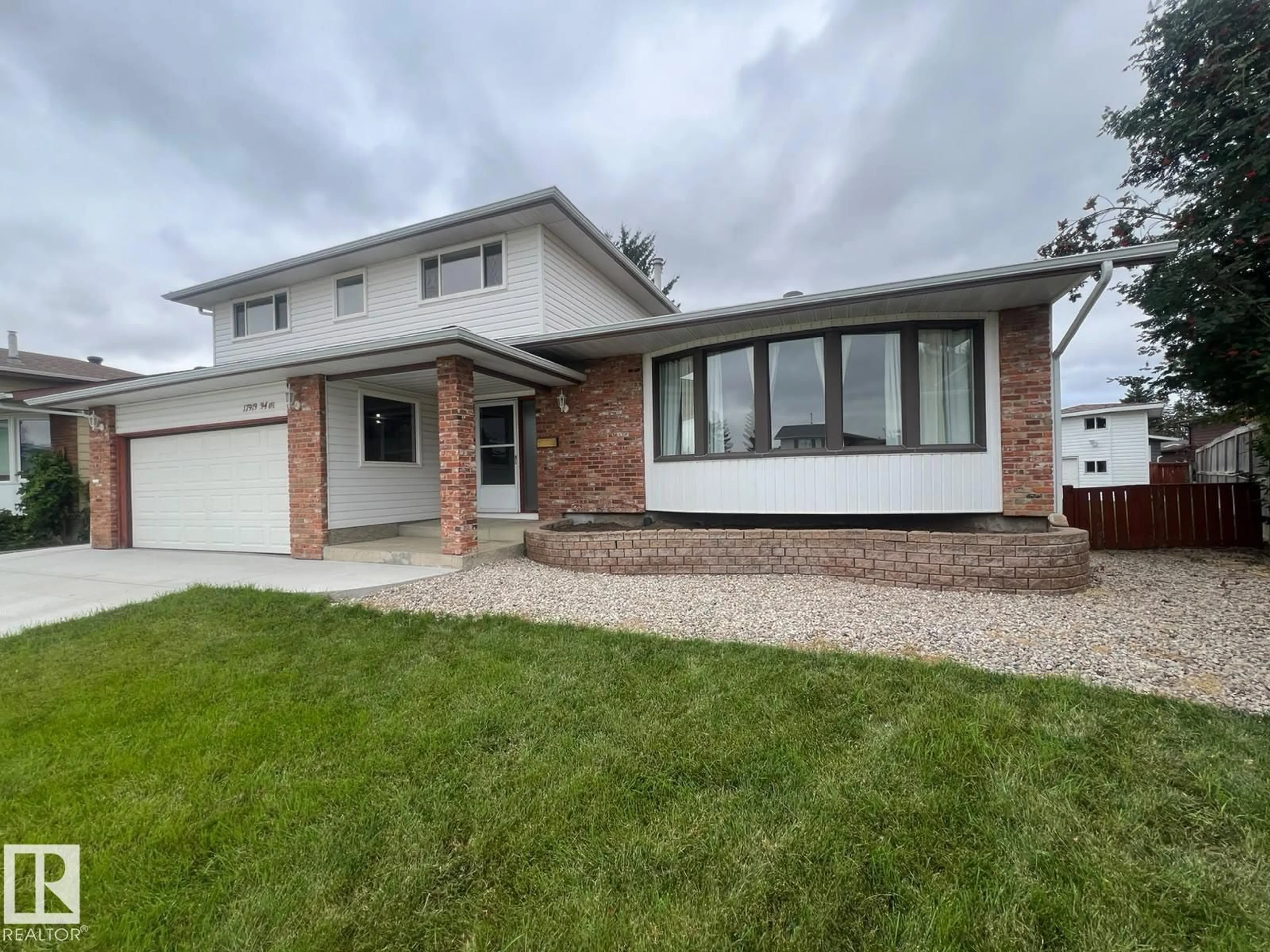 Home with vinyl exterior material, street for 17919 94 AV, Edmonton Alberta T5T1Y3