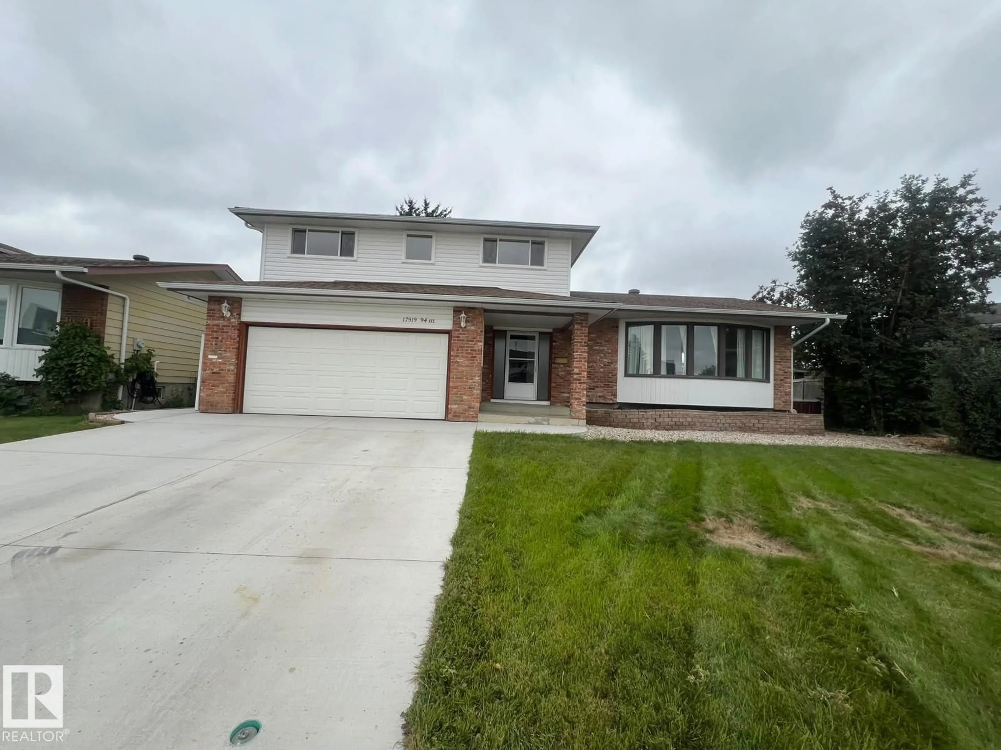 Home with brick exterior material, street for 17919 94 AV, Edmonton Alberta T5T1Y3