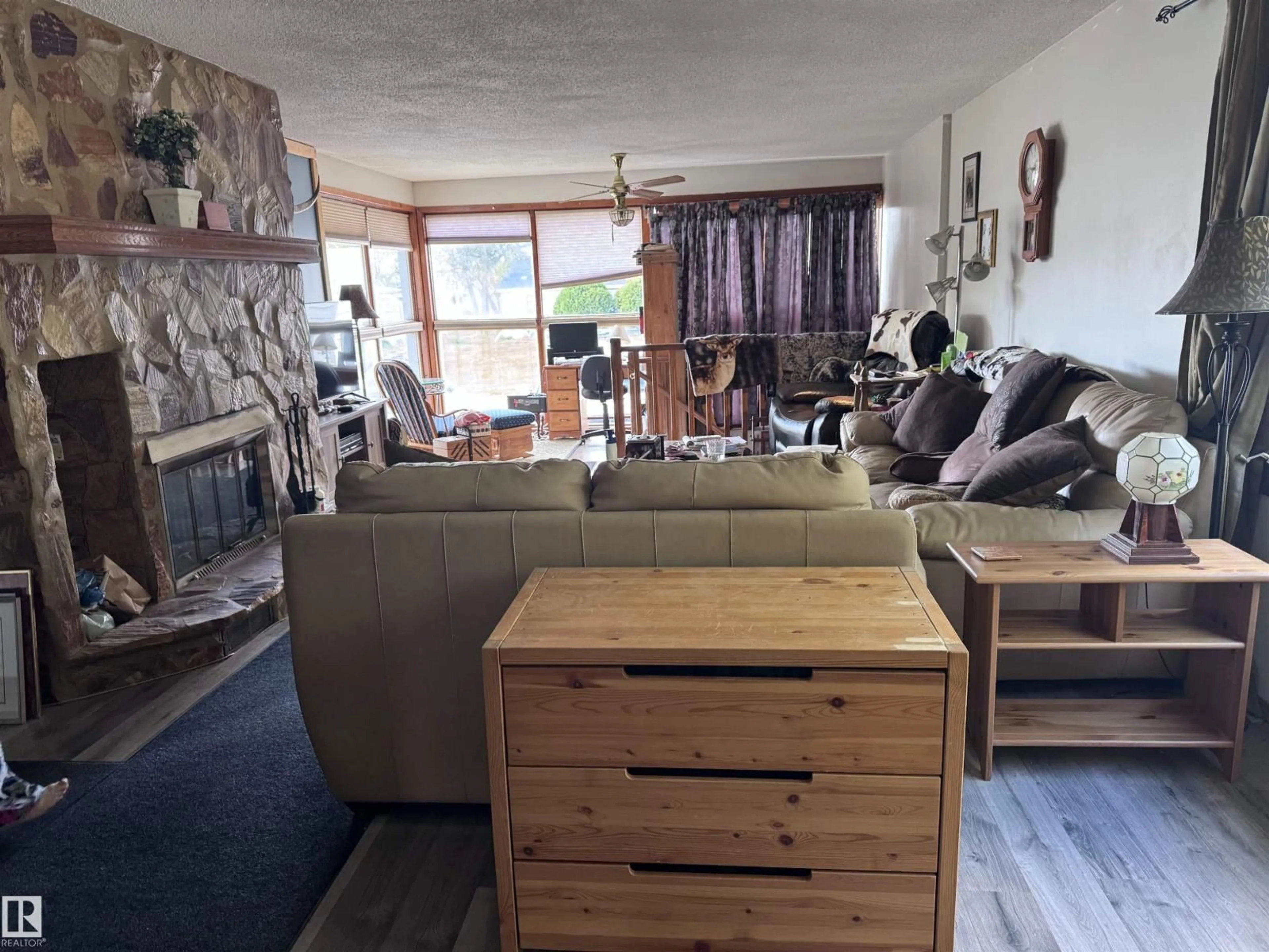 Living room with furniture, wood/laminate floor for 4713 51 AV, Pickardville Alberta T0G1W0