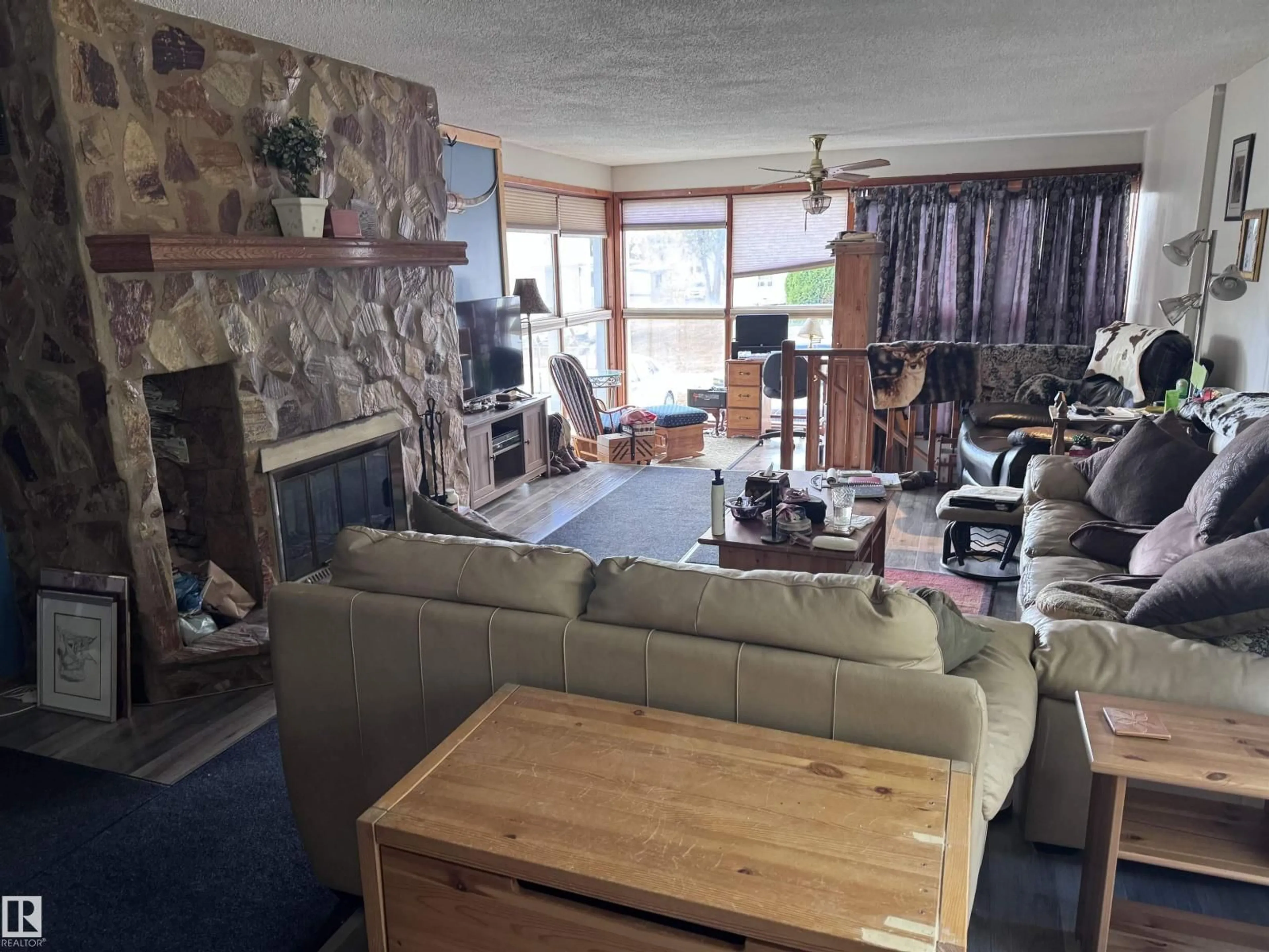Living room with furniture, wood/laminate floor for 4713 51 AV, Pickardville Alberta T0G1W0