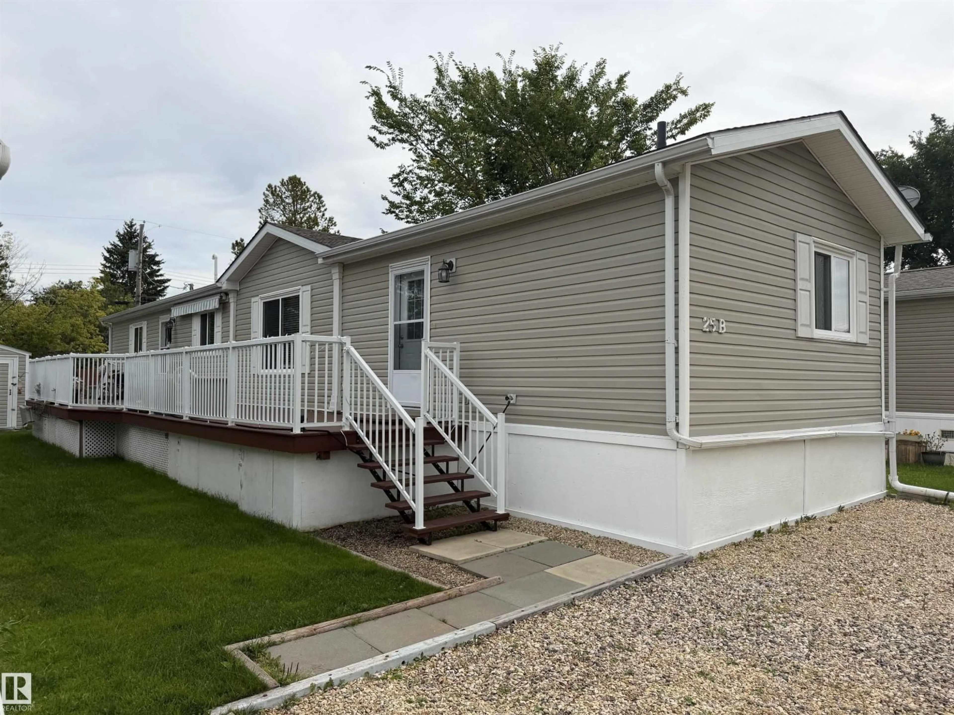Home with vinyl exterior material, street for 25B - 4515 50 AVENUE, Barrhead Alberta T7N1J6