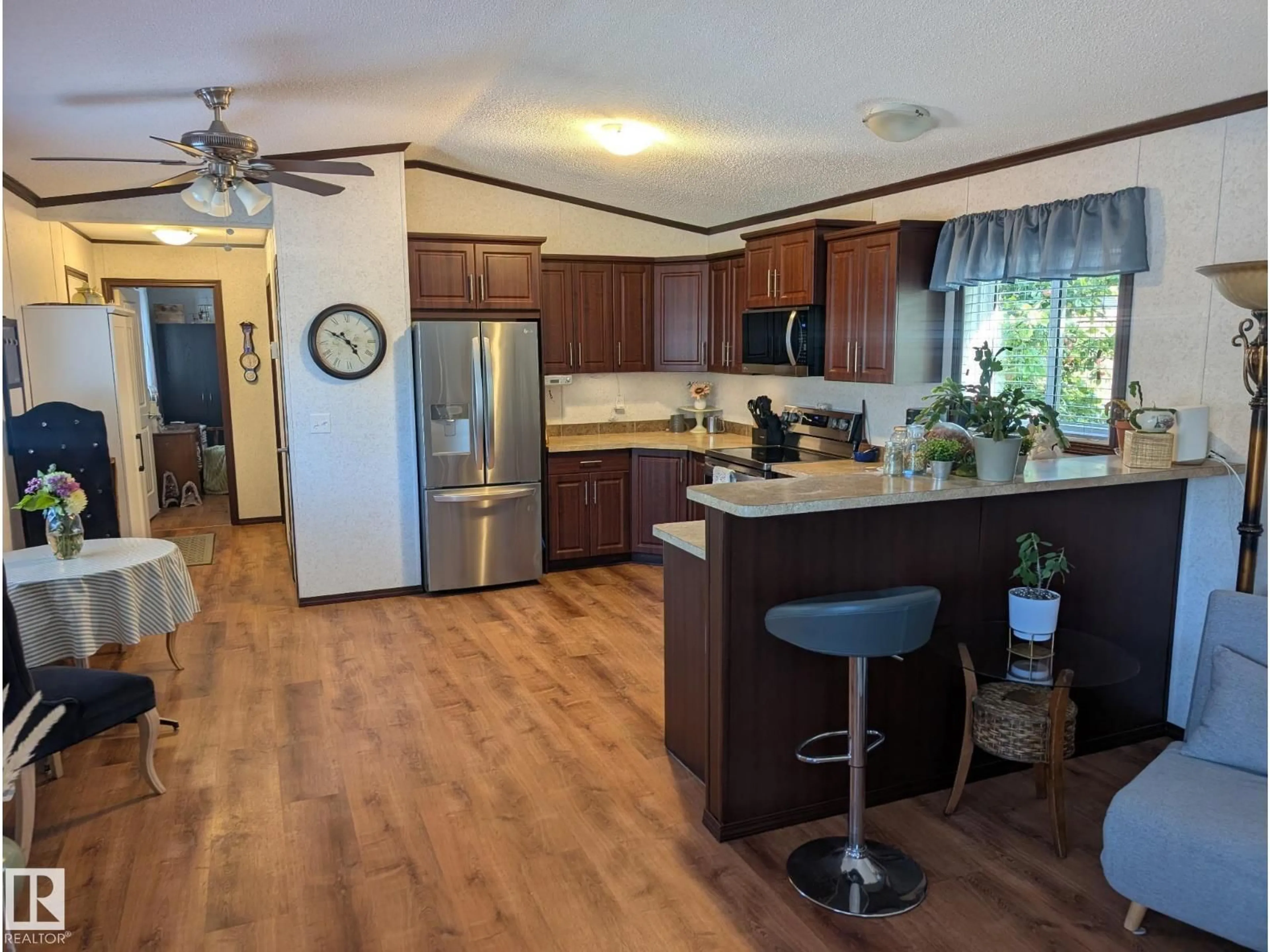 Open concept kitchen, wood/laminate floor for 25B - 4515 50 AVENUE, Barrhead Alberta T7N1J6