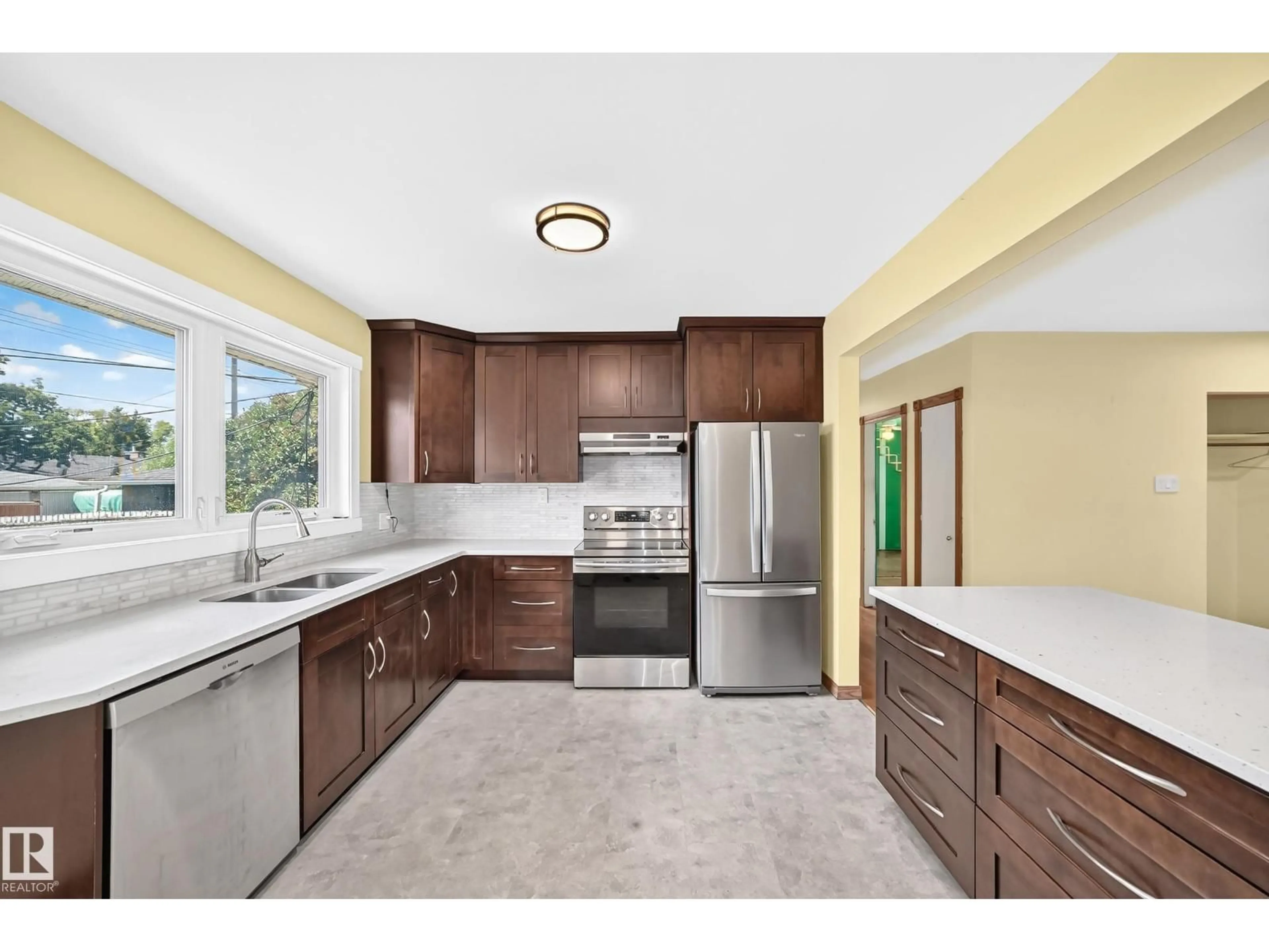 Open concept kitchen, ceramic/tile floor for 7032 81 ST, Edmonton Alberta T6C2T4