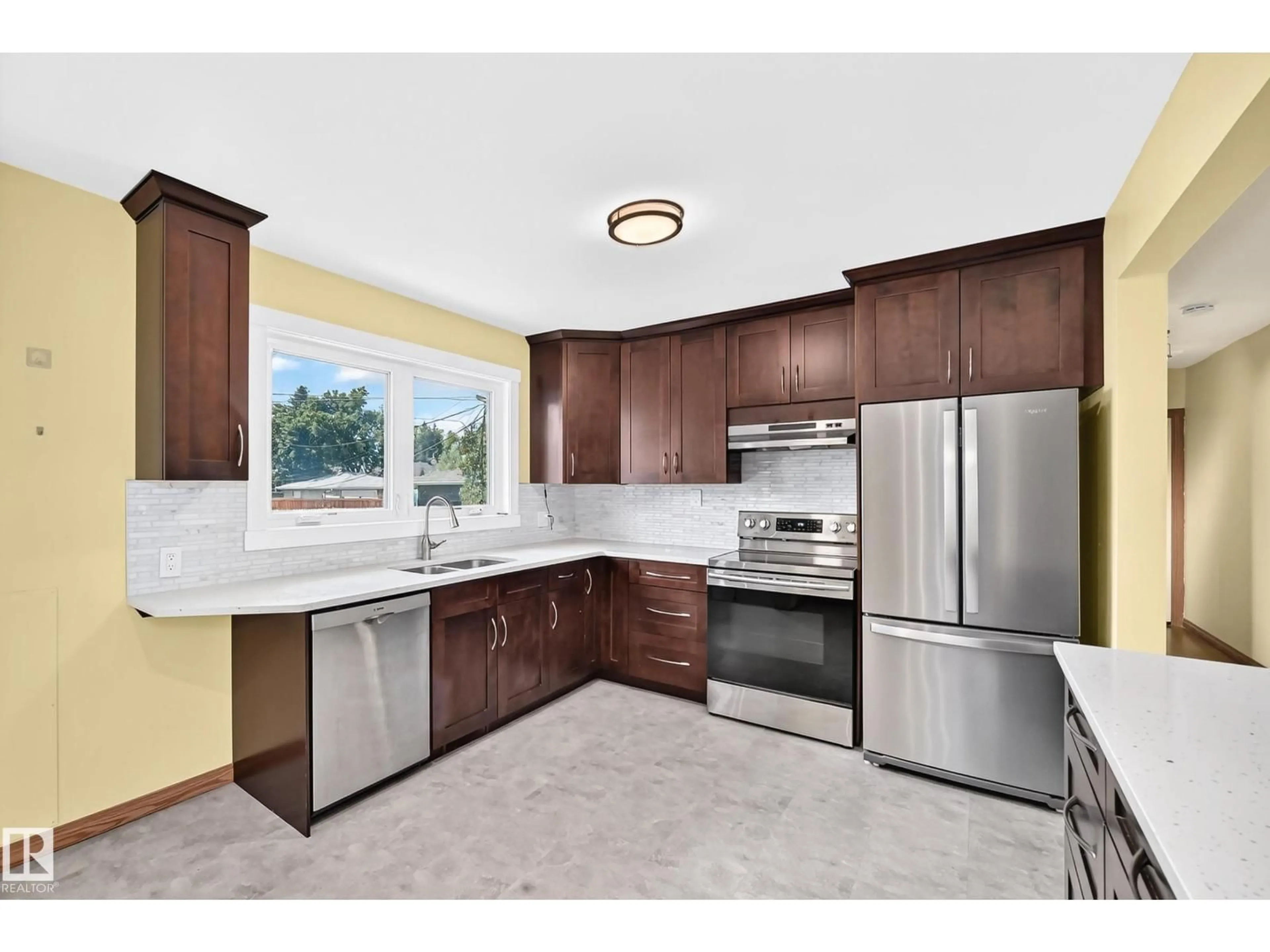 Open concept kitchen, ceramic/tile floor for 7032 81 ST, Edmonton Alberta T6C2T4