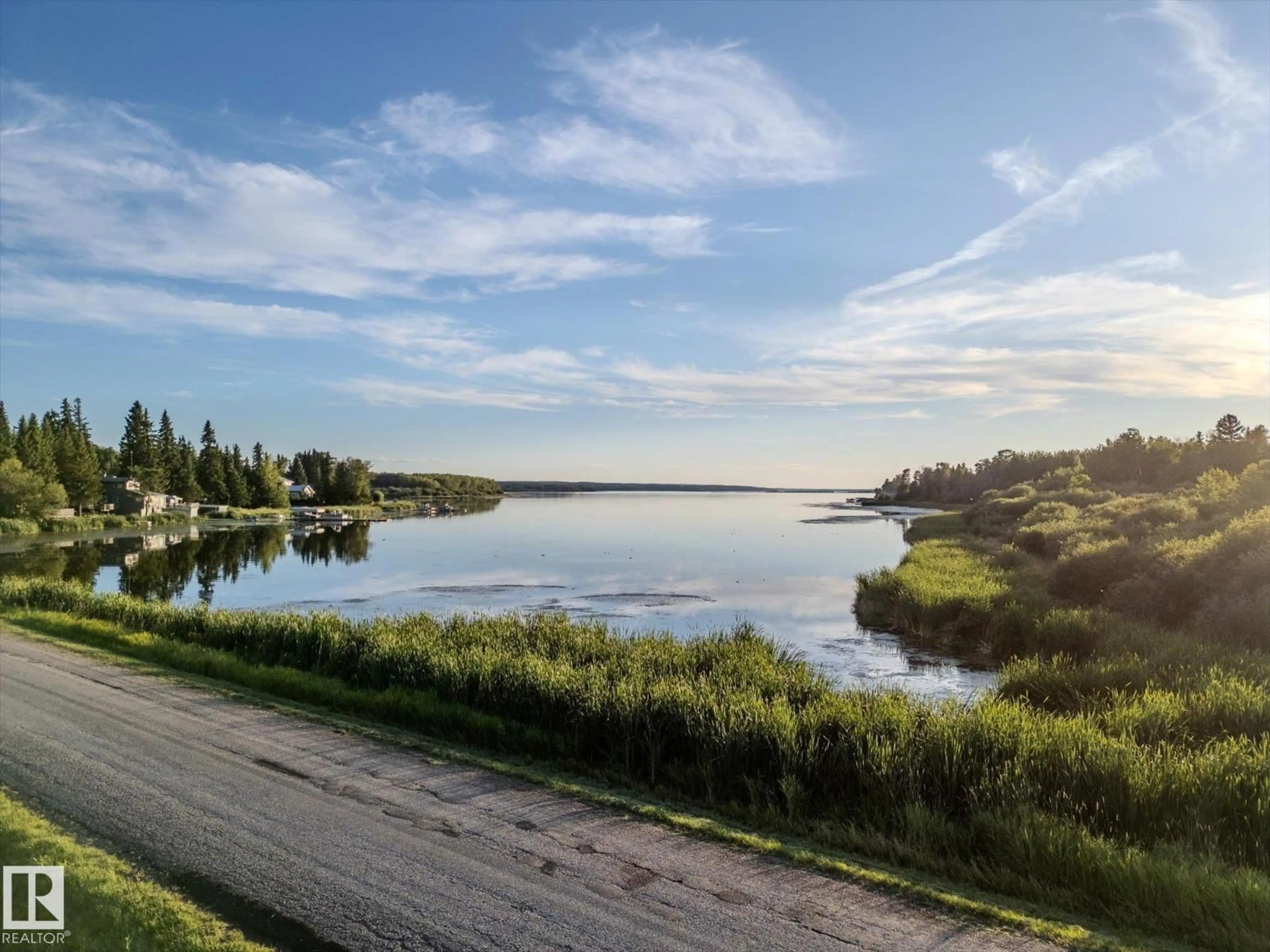 A pic from outside/outdoor area/front of a property/back of a property/a pic from drone, water/lake/river/ocean view for 5323 - 49 TOWNSHIP ROAD 541 A, Rural Lac Ste. Anne County Alberta T0E1H0