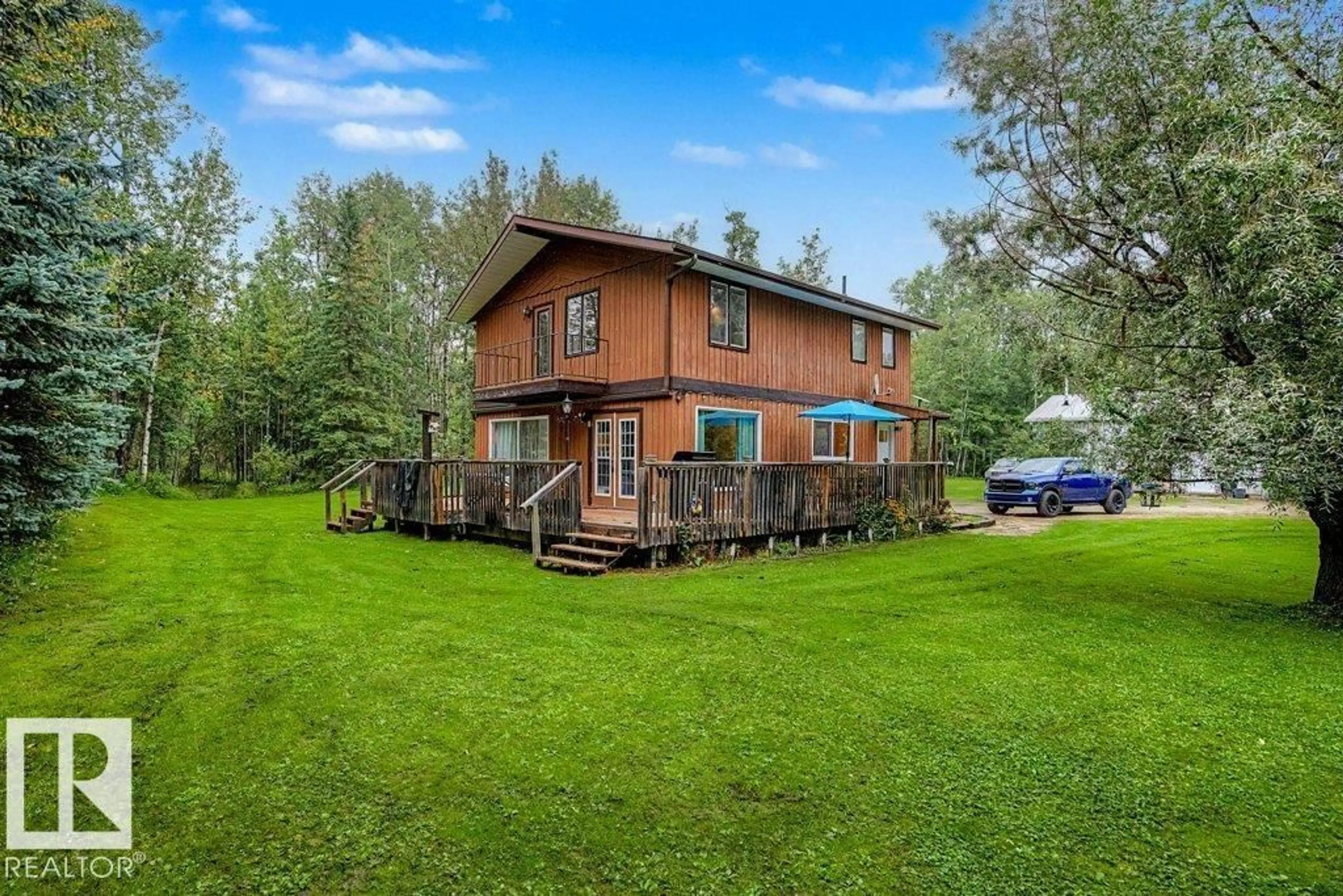 A pic from outside/outdoor area/front of a property/back of a property/a pic from drone, water/lake/river/ocean view for 12 53223 RGE ROAD 34, Rural Parkland County Alberta T0E0N0