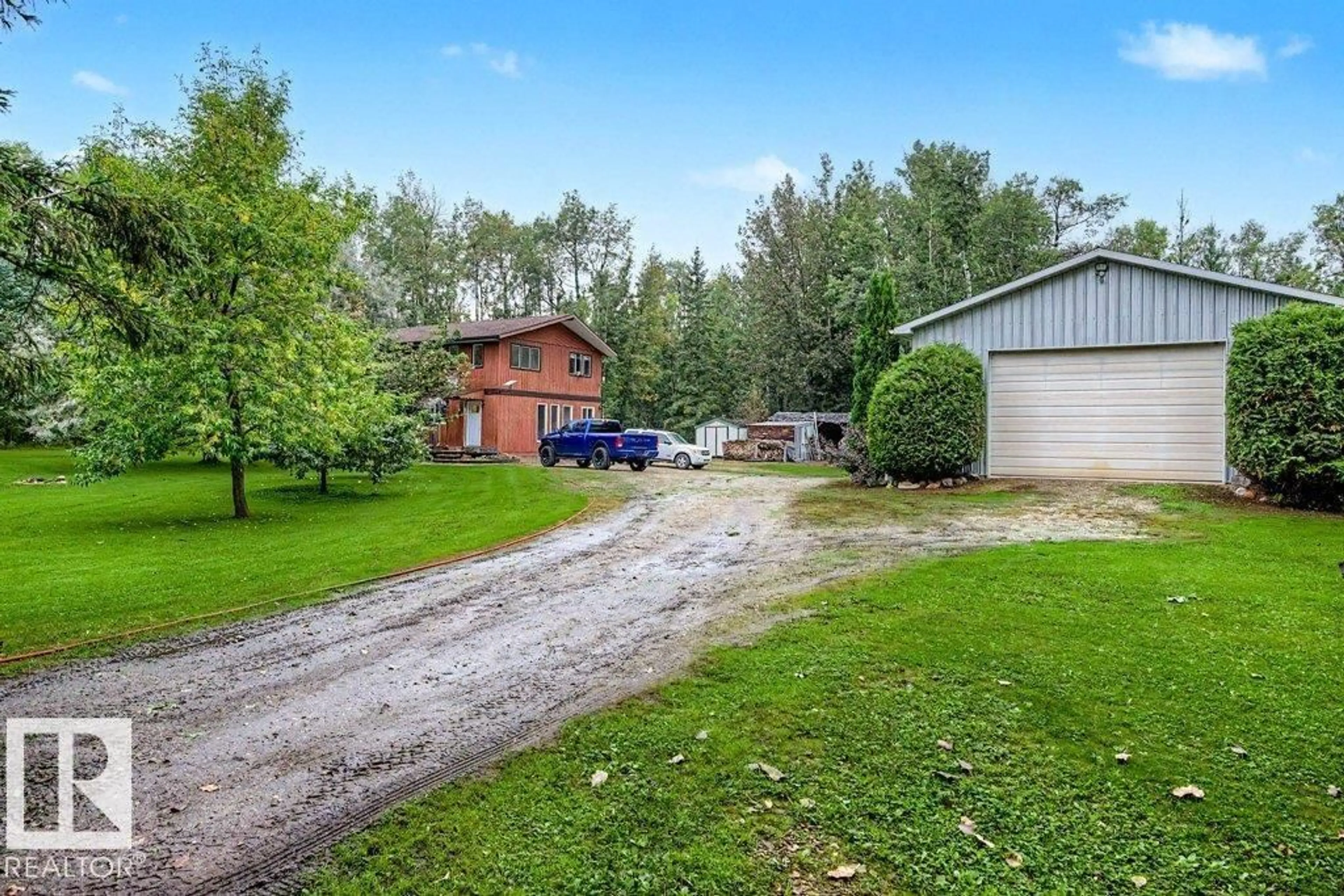 A pic from outside/outdoor area/front of a property/back of a property/a pic from drone, street for 12 53223 RGE ROAD 34, Rural Parkland County Alberta T0E0N0