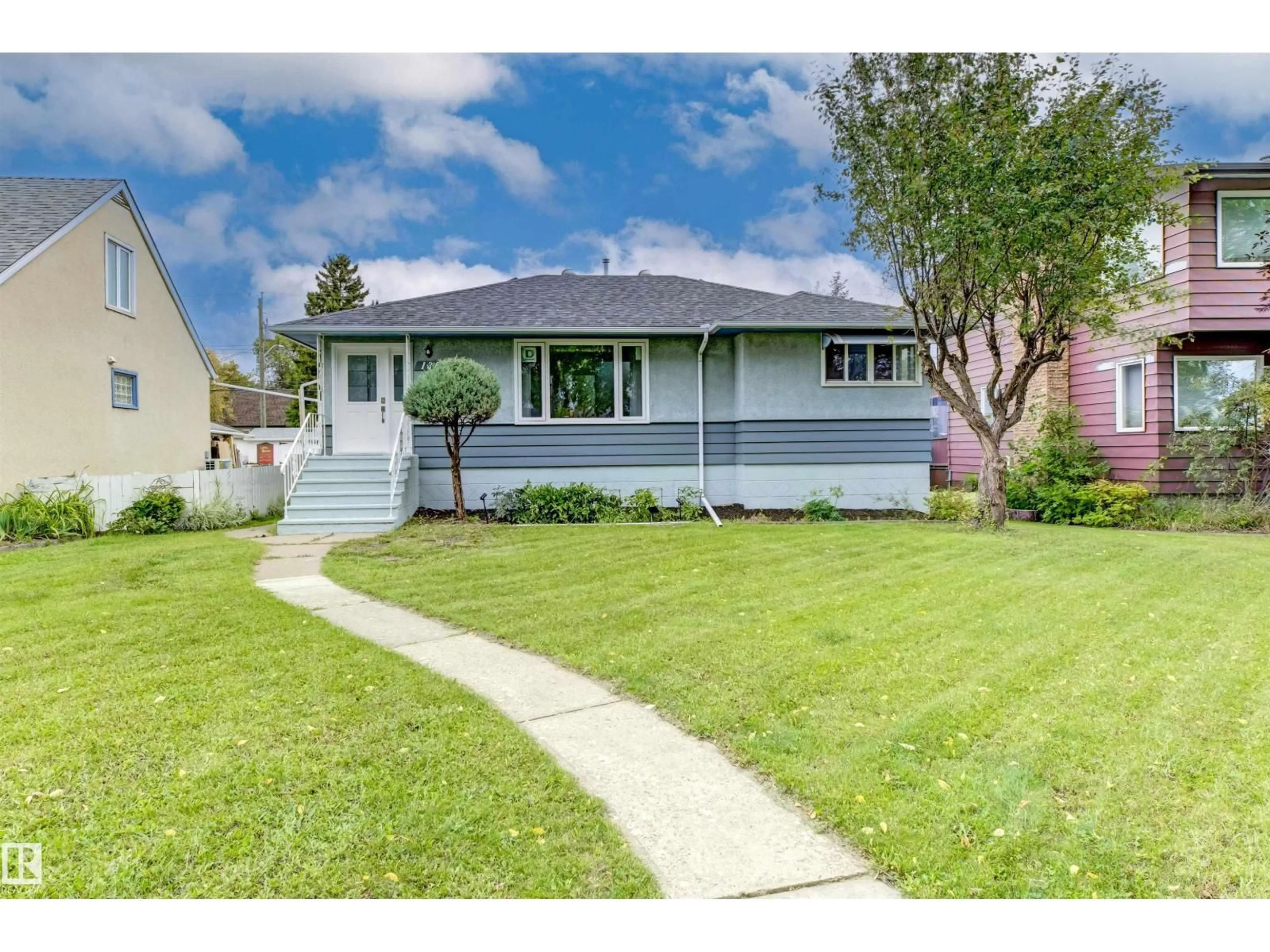 Home with vinyl exterior material, street for 13024 SHERBROOKE AV, Edmonton Alberta T5L4E8