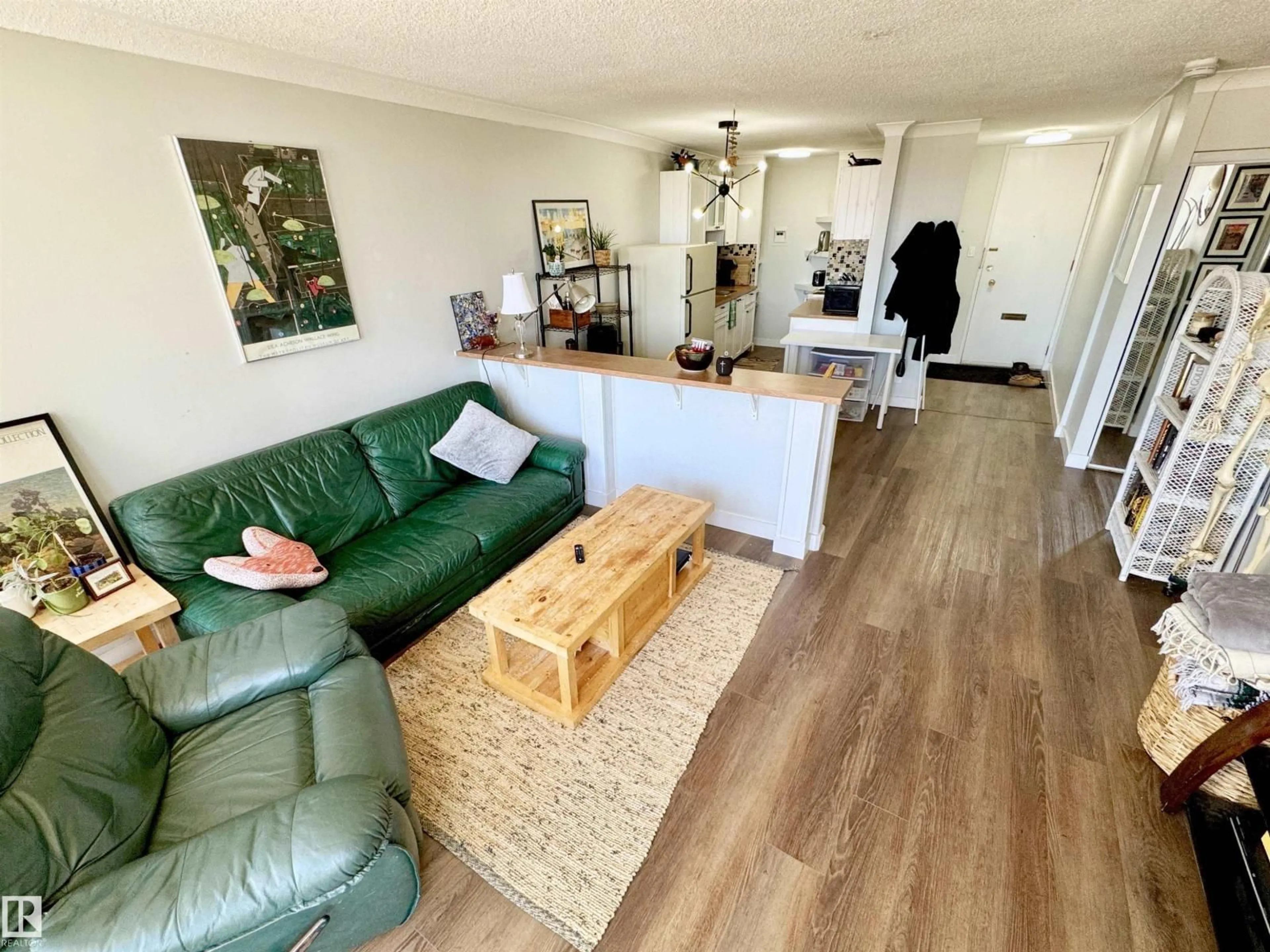 Living room with furniture, wood/laminate floor for #204 - 10883 SASKATCHEWAN DR, Edmonton Alberta T6E4S6