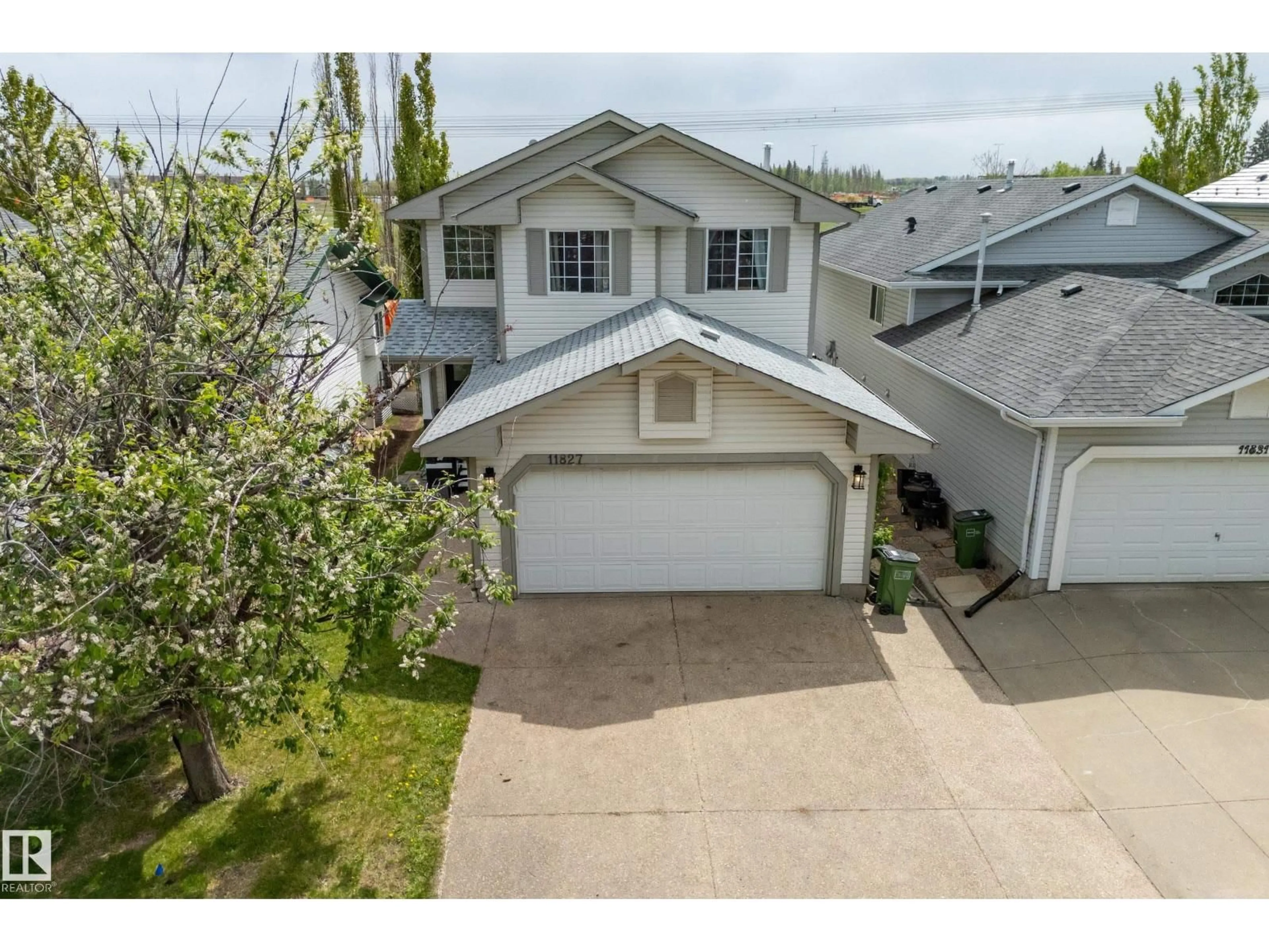 A pic from outside/outdoor area/front of a property/back of a property/a pic from drone, street for 11827 8 AV, Edmonton Alberta T6J6Z9