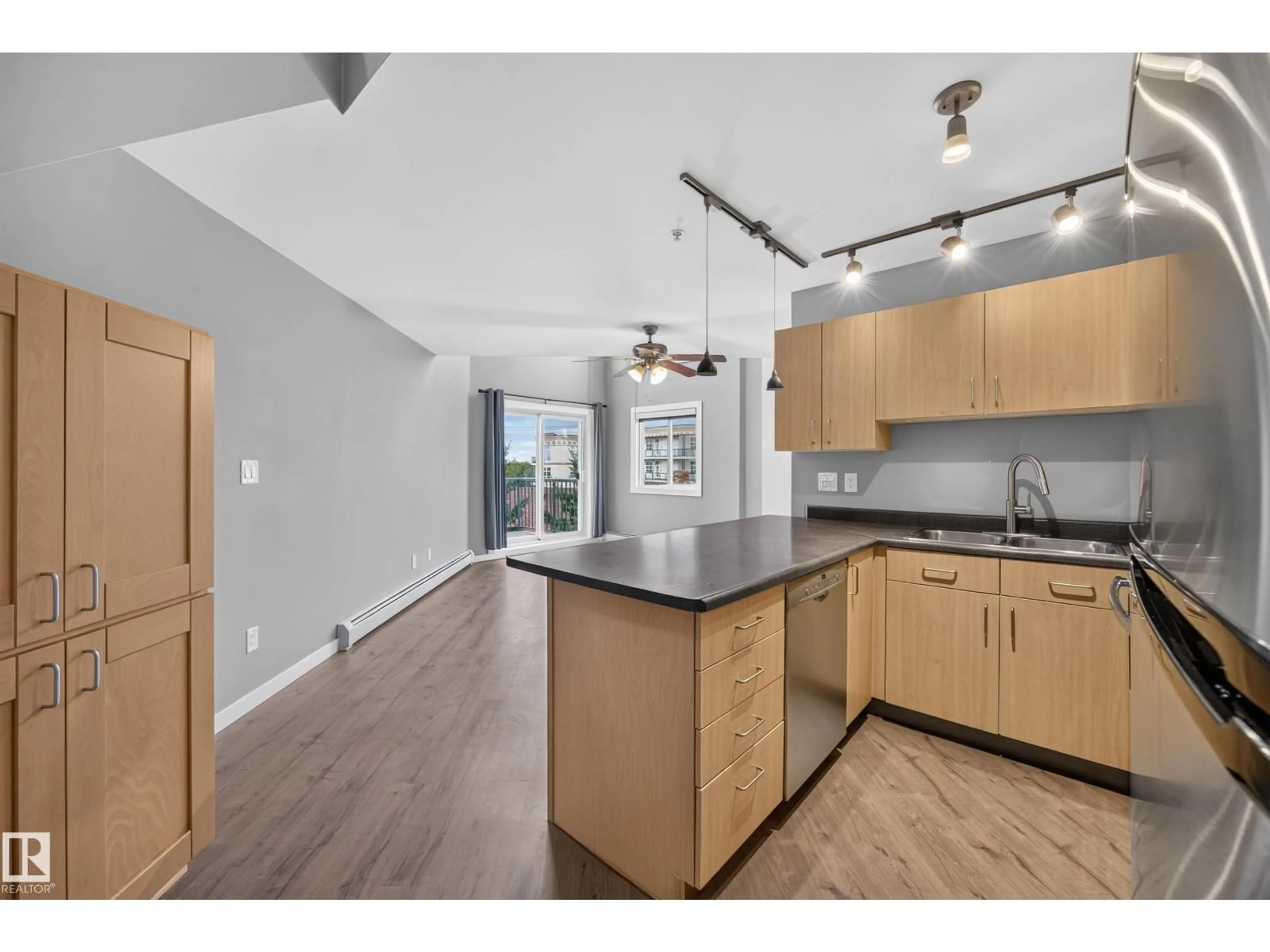 Open concept kitchen, wood/laminate floor for 405 10118 95 ST NW, Edmonton Alberta T5H4R6