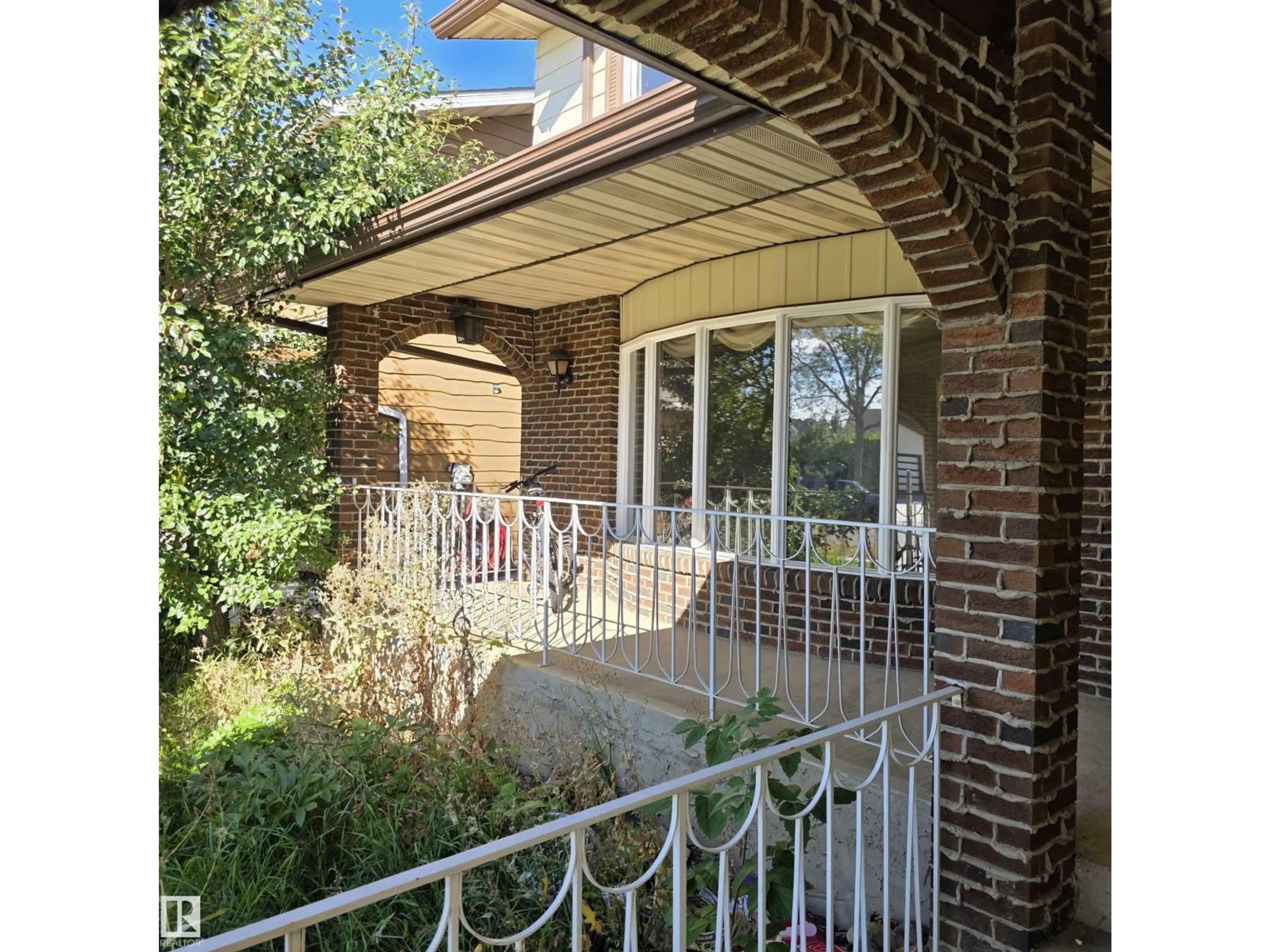 Home with brick exterior material, street for 11022 158 AV, Edmonton Alberta T5X4V4